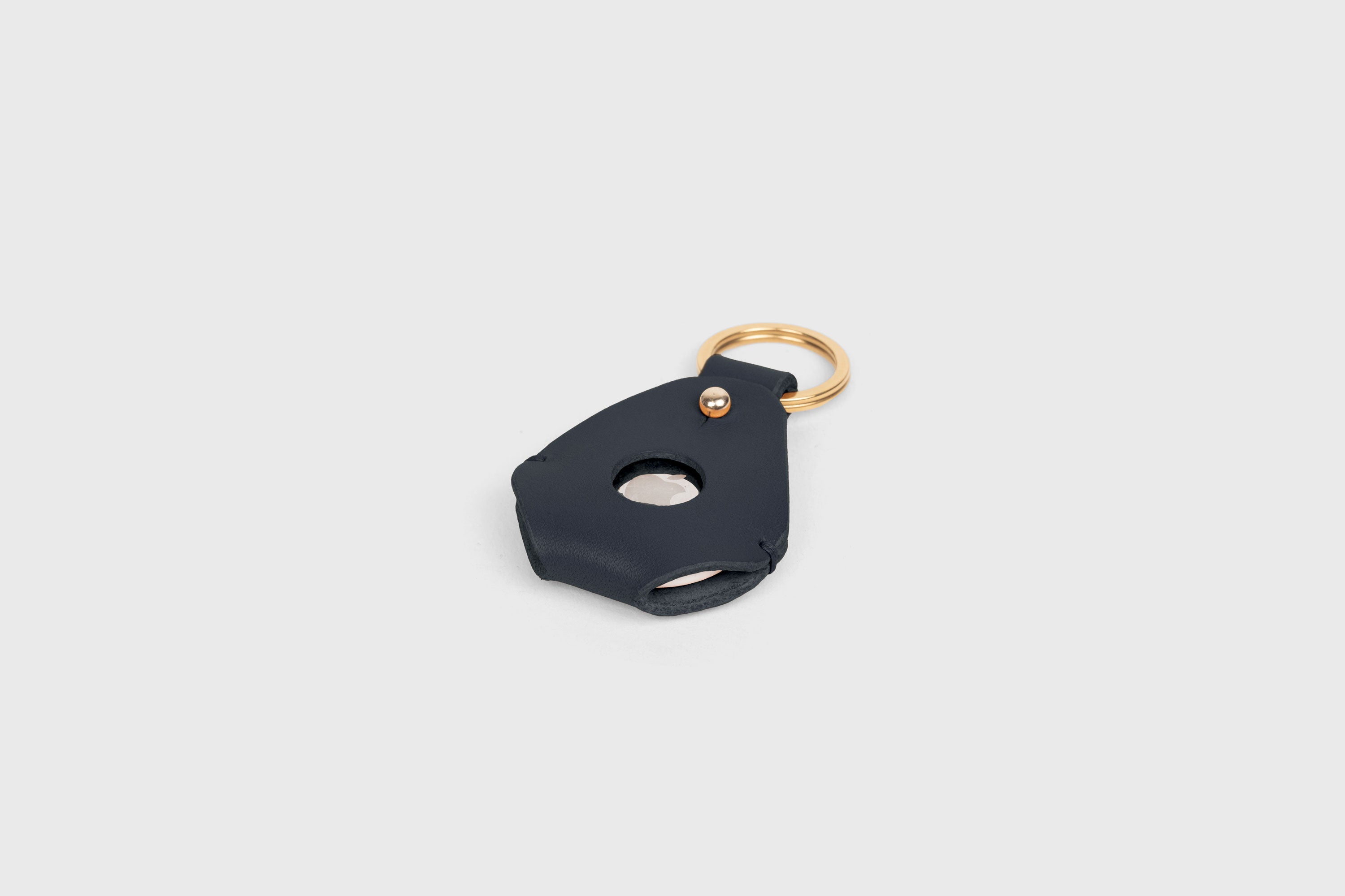 Airtag Key Ring In Marine Blue Color In Vegetable Tanned Leather Minimalistic Design Atelier Madre Manuel Dreesmann Barcelona Spain