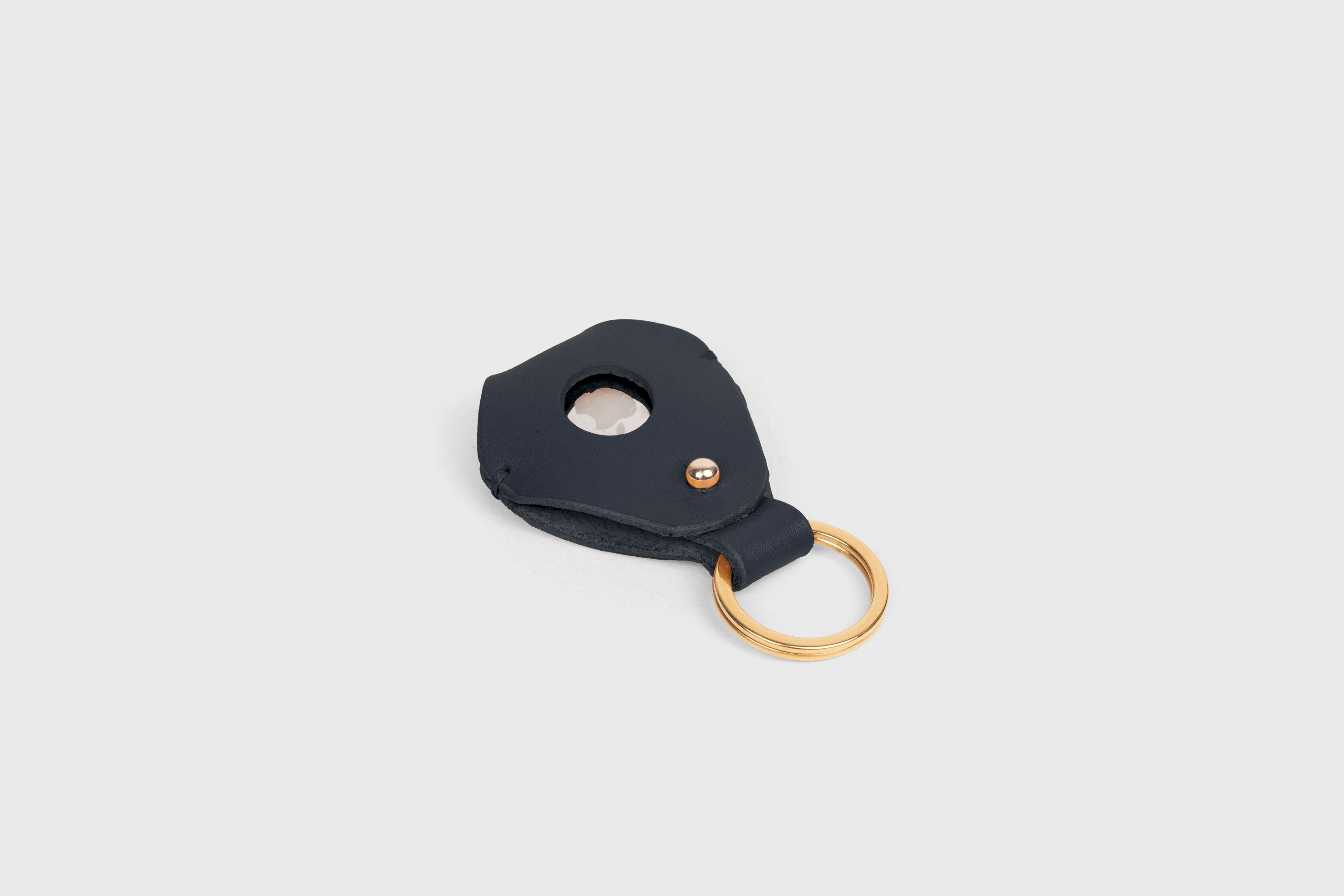 Airtag Key Ring In Marine Blue Color In Vegetable Tanned Leather Minimalistic Design Atelier Madre Manuel Dreesmann Barcelona Spain