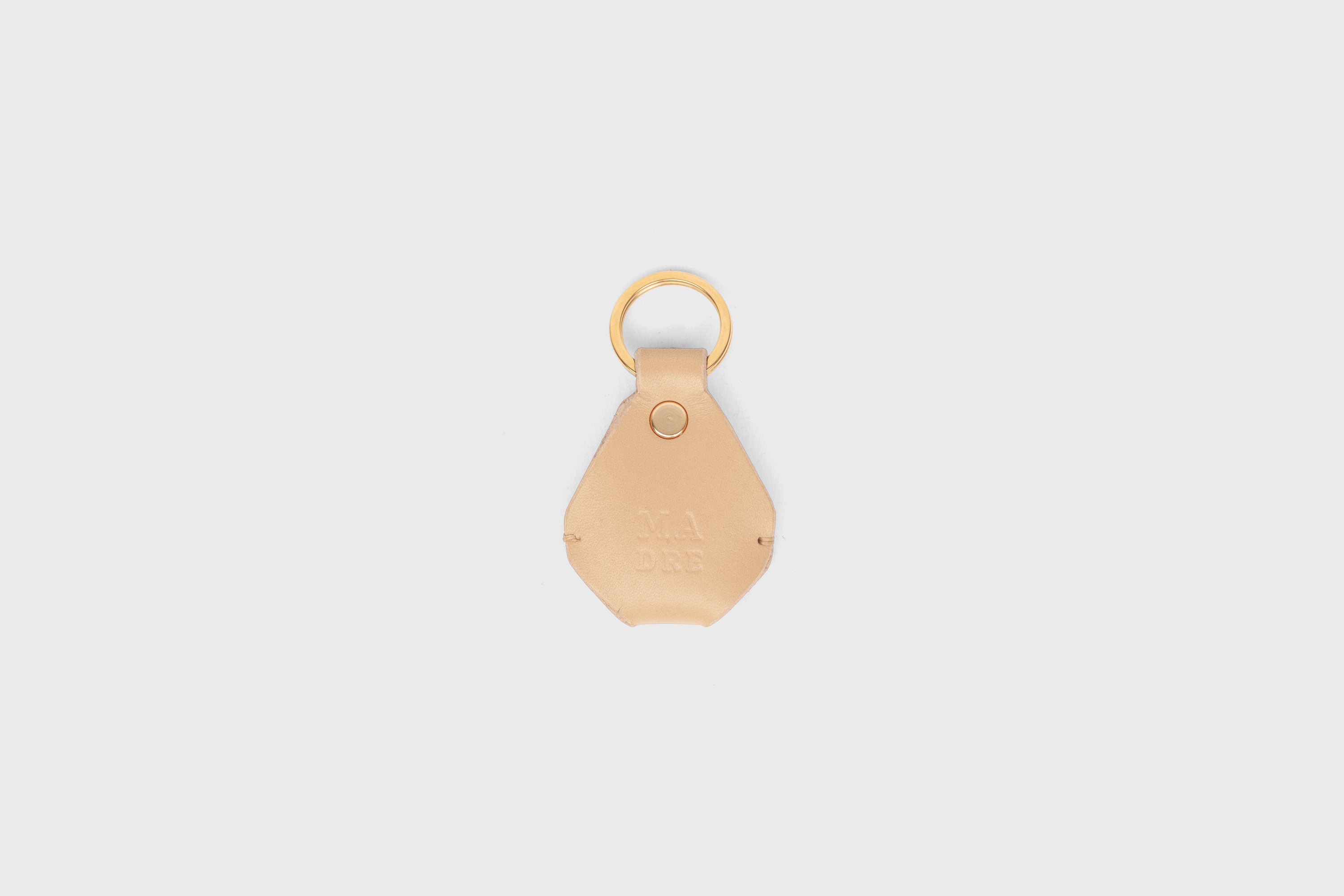 Airtag Key Ring In Natural Color In Vegetable Tanned Leather Minimalistic Design Atelier Madre Manuel Dreesmann Barcelona Spain