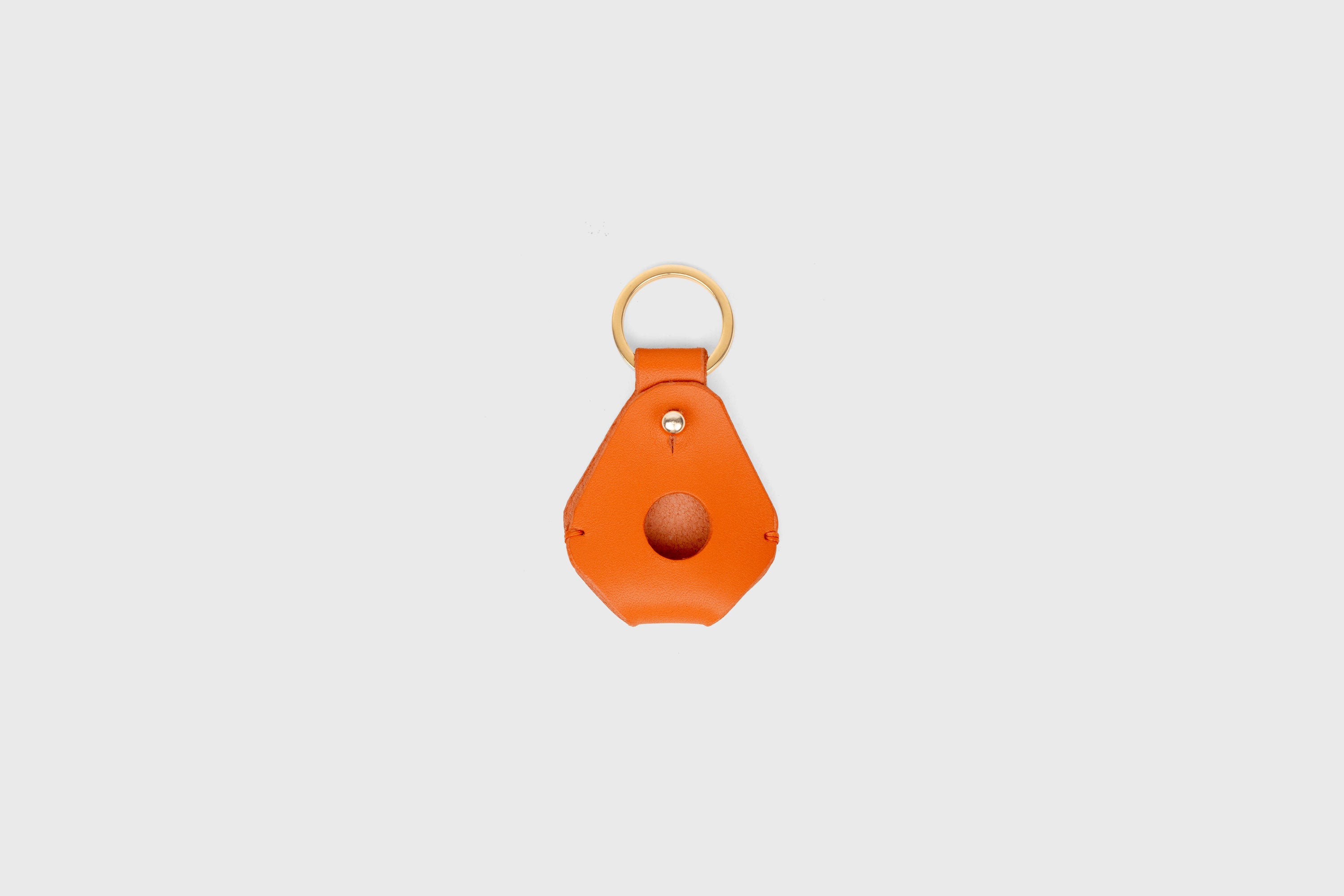 Airtag Key Ring In Orange Color In Vegetable Tanned Leather Minimalistic Design Atelier Madre Manuel Dreesmann Barcelona Spain
