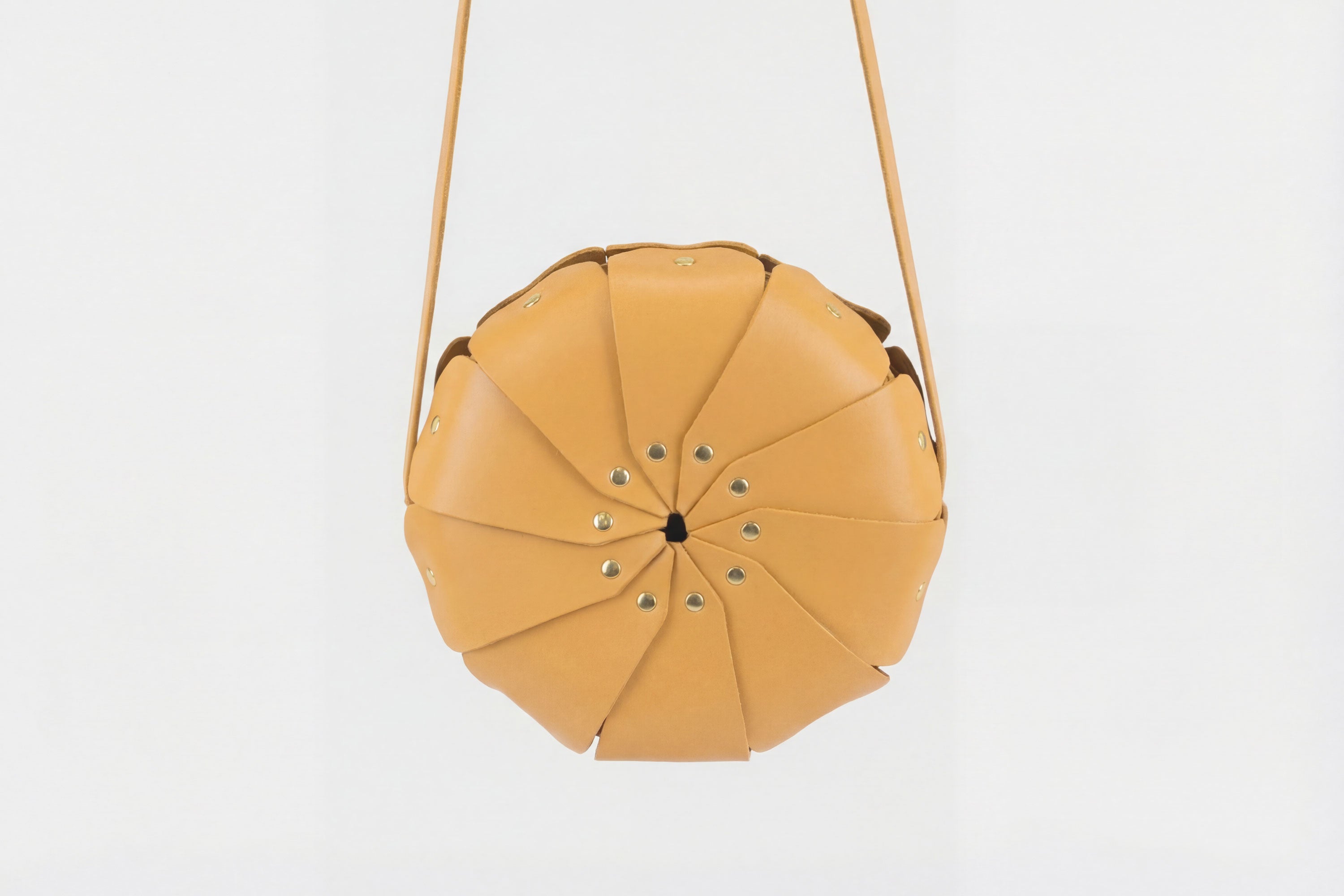 Anemo Leather Bag Front Brown Color Floral Design Premium Minimalist Modern Circle Round Pouch Crossbody Atelier Madre Manuel Dreesmann Barcelona Spain