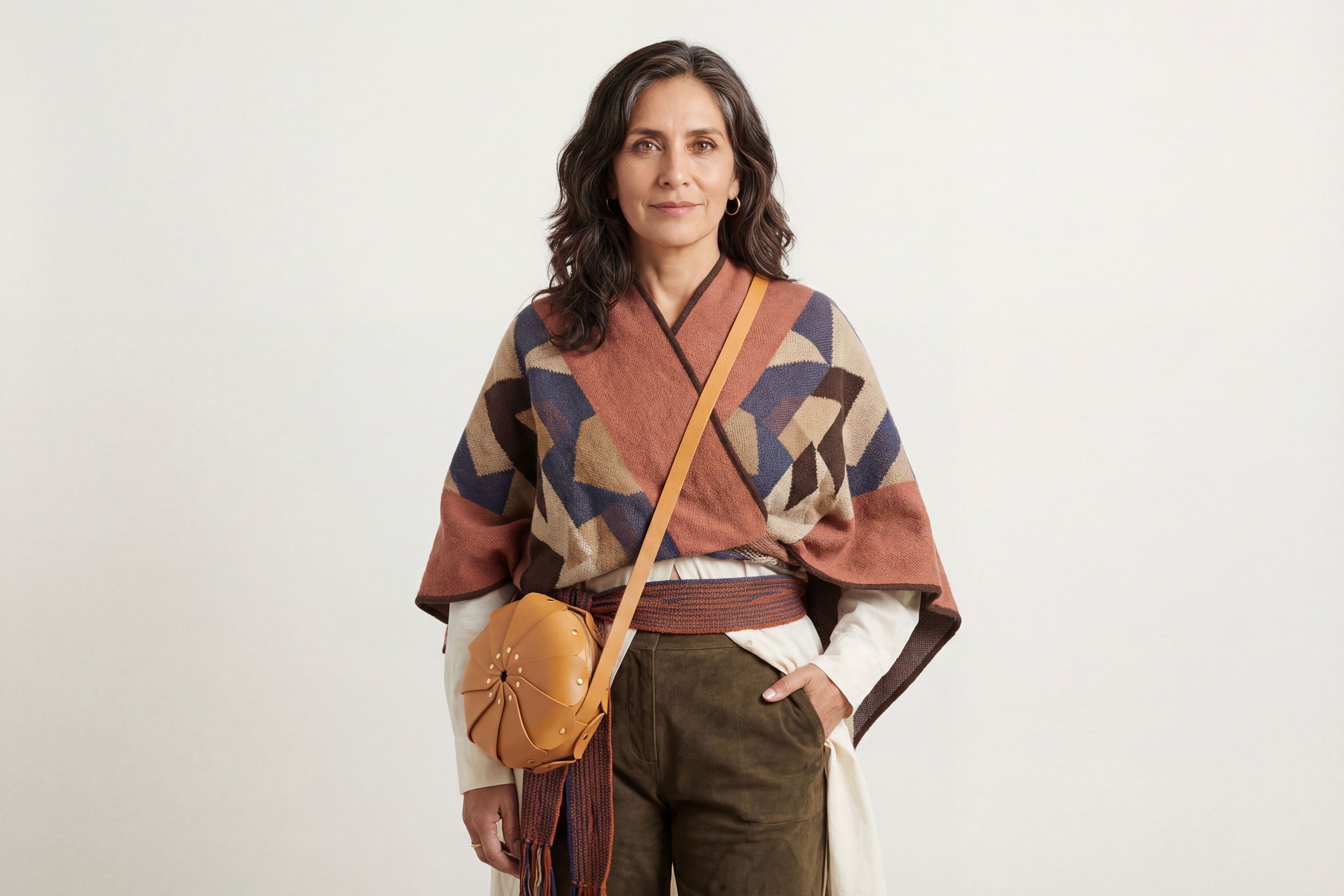 Anemo Leather Bag Brown Color On A Woman Model Floral Design Premium Minimalist Modern Circle Round Pouch Crossbody Atelier Madre Manuel Dreesmann Barcelona Spain