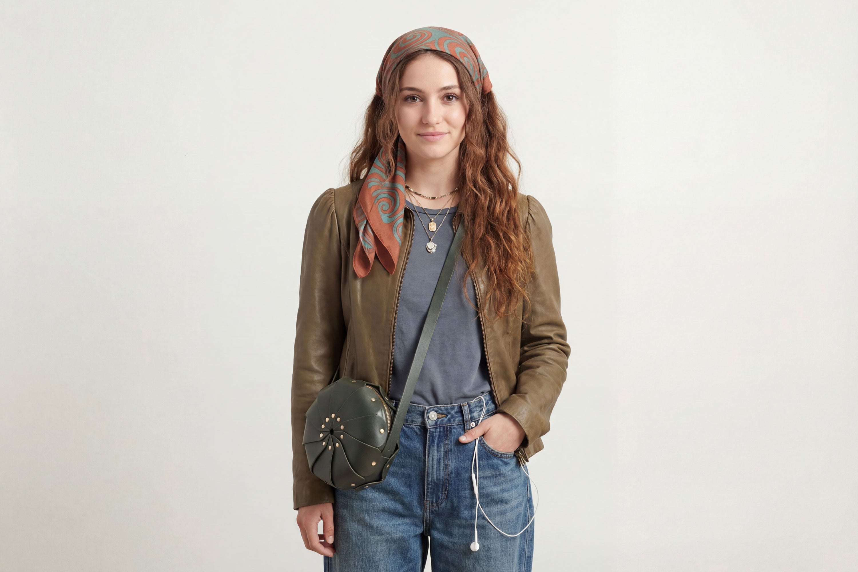 Anemo Leather Bag Olive Green Color On A Woman Model Floral Design Premium Minimalist Modern Circle Round Pouch Crossbody Atelier Madre Manuel Dreesmann Barcelona Spain