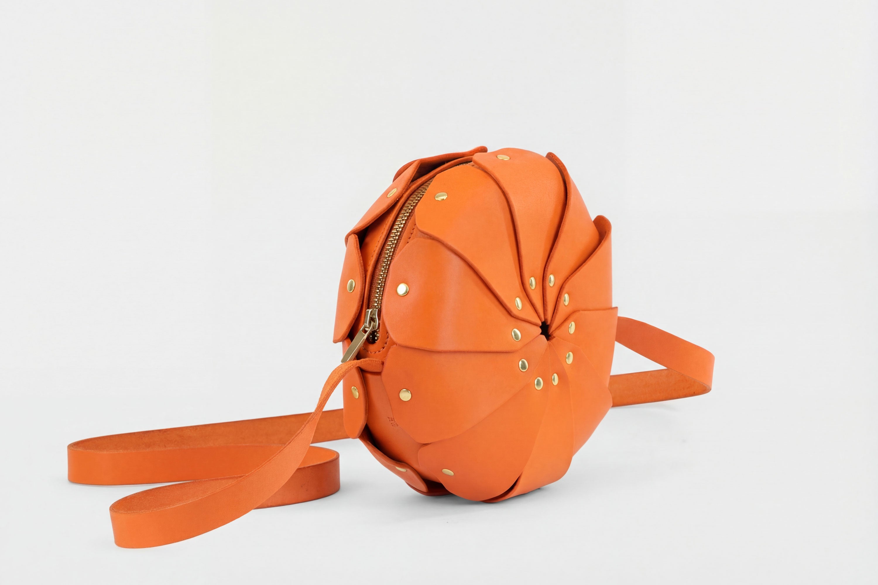 Anemo Leather Bag Orange Color Floral Design Premium Minimalist Modern Circle Round Pouch Crossbody Atelier Madre Manuel Dreesmann Barcelona Spain