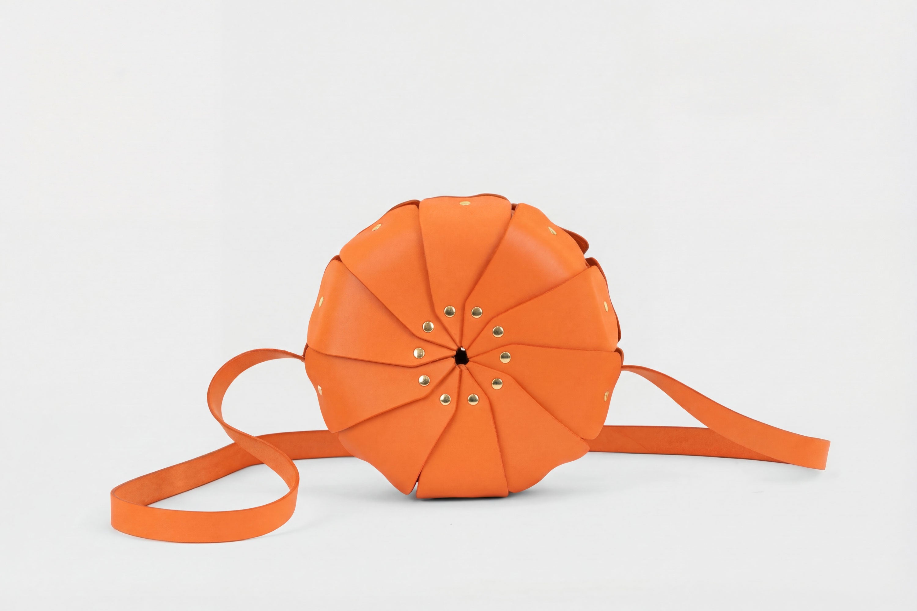 Anemo Leather Bag Orange Color Floral Design Premium Minimalist Modern Circle Round Pouch Crossbody Atelier Madre Manuel Dreesmann Barcelona Spain