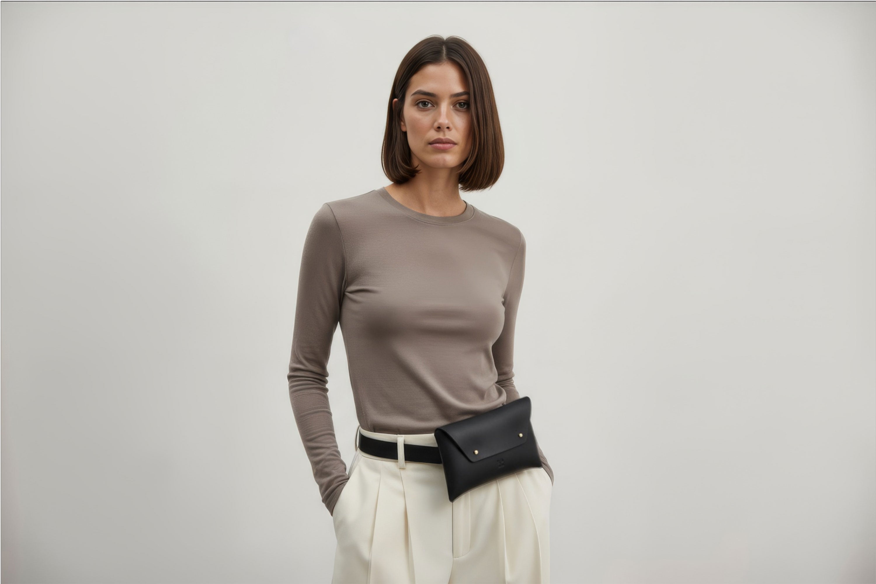 Belt Bag Leather Black Color On A Woman Model Fanny Pack Waist Bag Vegetable Tanned Leather Full Grain Premium Quality Modern Minimalist Design Atelier Madre Manuel Dreesmann Barcelona Spain