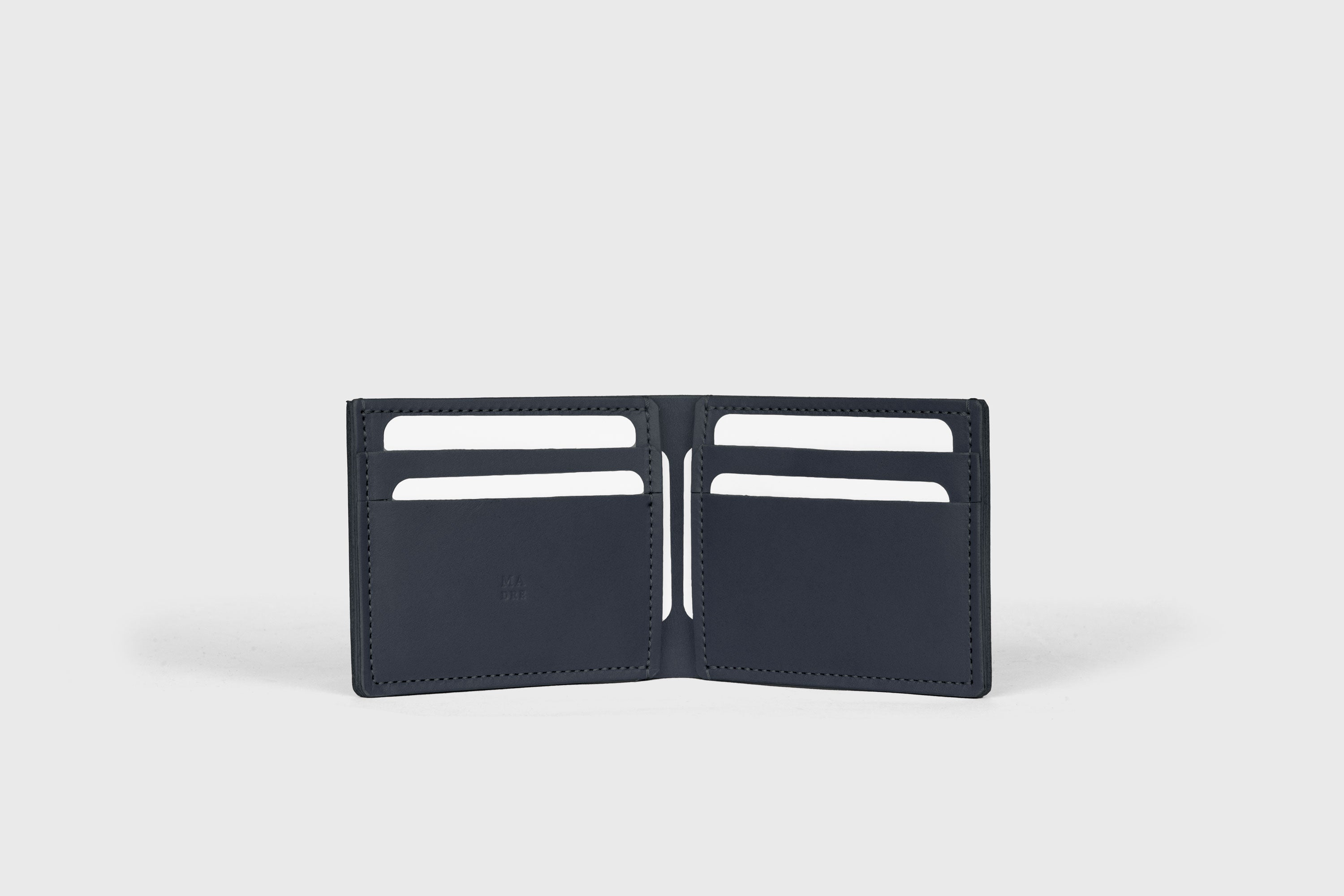 Bifold Wallet Horizontal With 6 Card Slots In Marine Blue Color In Vegetable Tanned Leather Minimalistic Design Atelier Madre Manuel Dreesmann Barcelona Spain