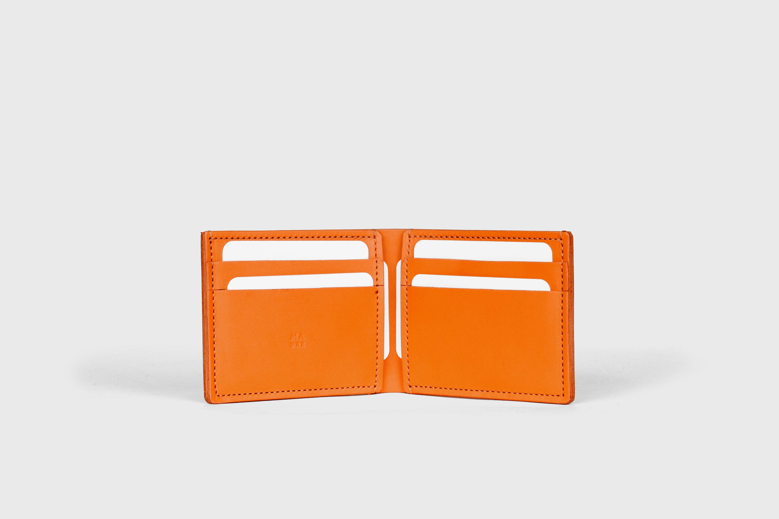 Bifold Wallet Horizontal With 6 Card Slots In Orange Color In Vegetable Tanned Leather Minimalistic Design Atelier Madre Manuel Dreesmann Barcelona Spain