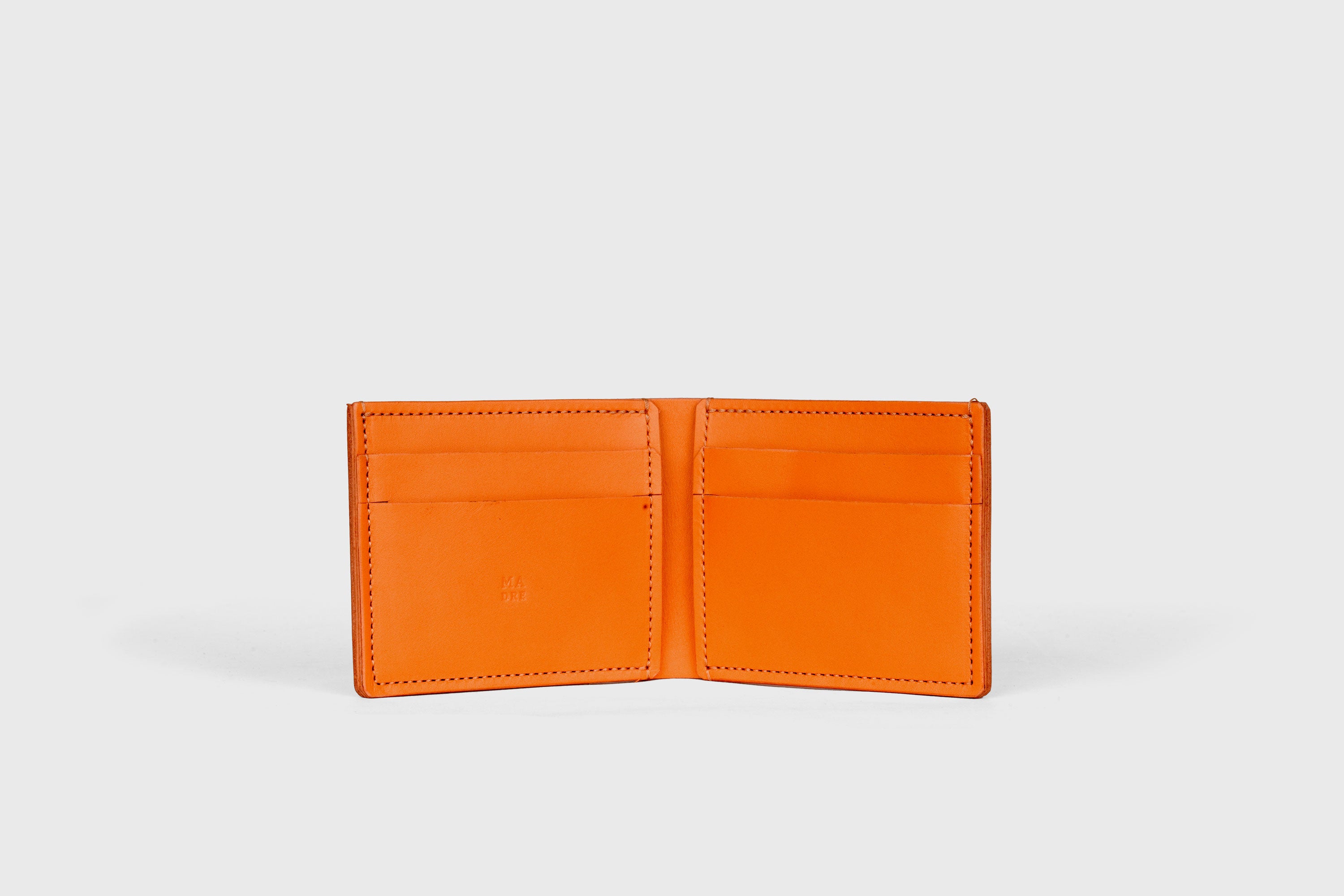 Bifold Wallet Horizontal With 6 Card Slots In Orange Color In Vegetable Tanned Leather Minimalistic Design Atelier Madre Manuel Dreesmann Barcelona Spain