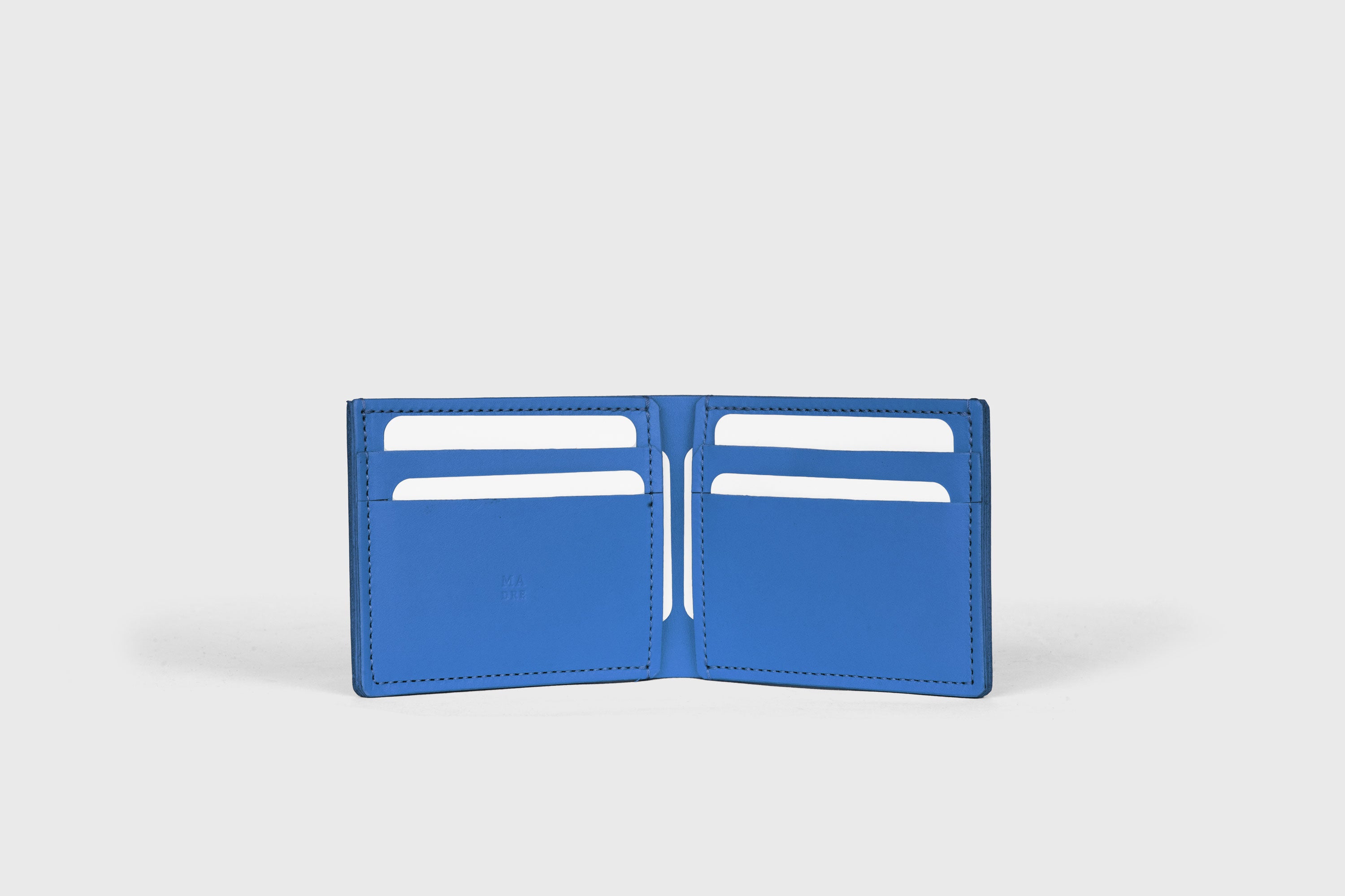 Bifold Wallet Horizontal With 6 Card Slots In Royal Blue Color In Vegetable Tanned Leather Minimalistic Design Atelier Madre Manuel Dreesmann Barcelona Spain