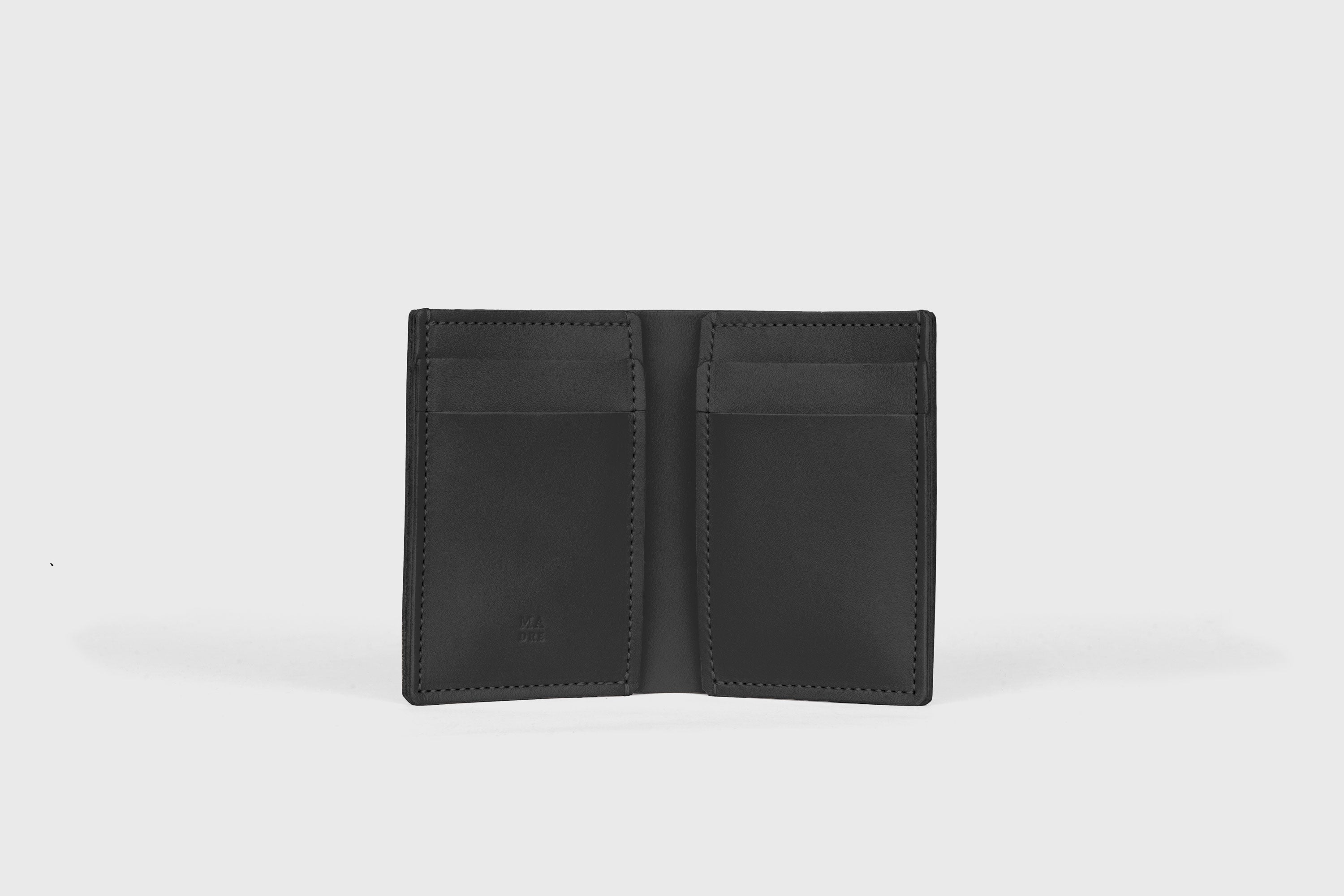 Bifold Wallet Vertical 6 Slots In Black Color In Vegetable Tanned Leather Minimalistic Design Atelier Madre Manuel Dreesmann Barcelona Spain