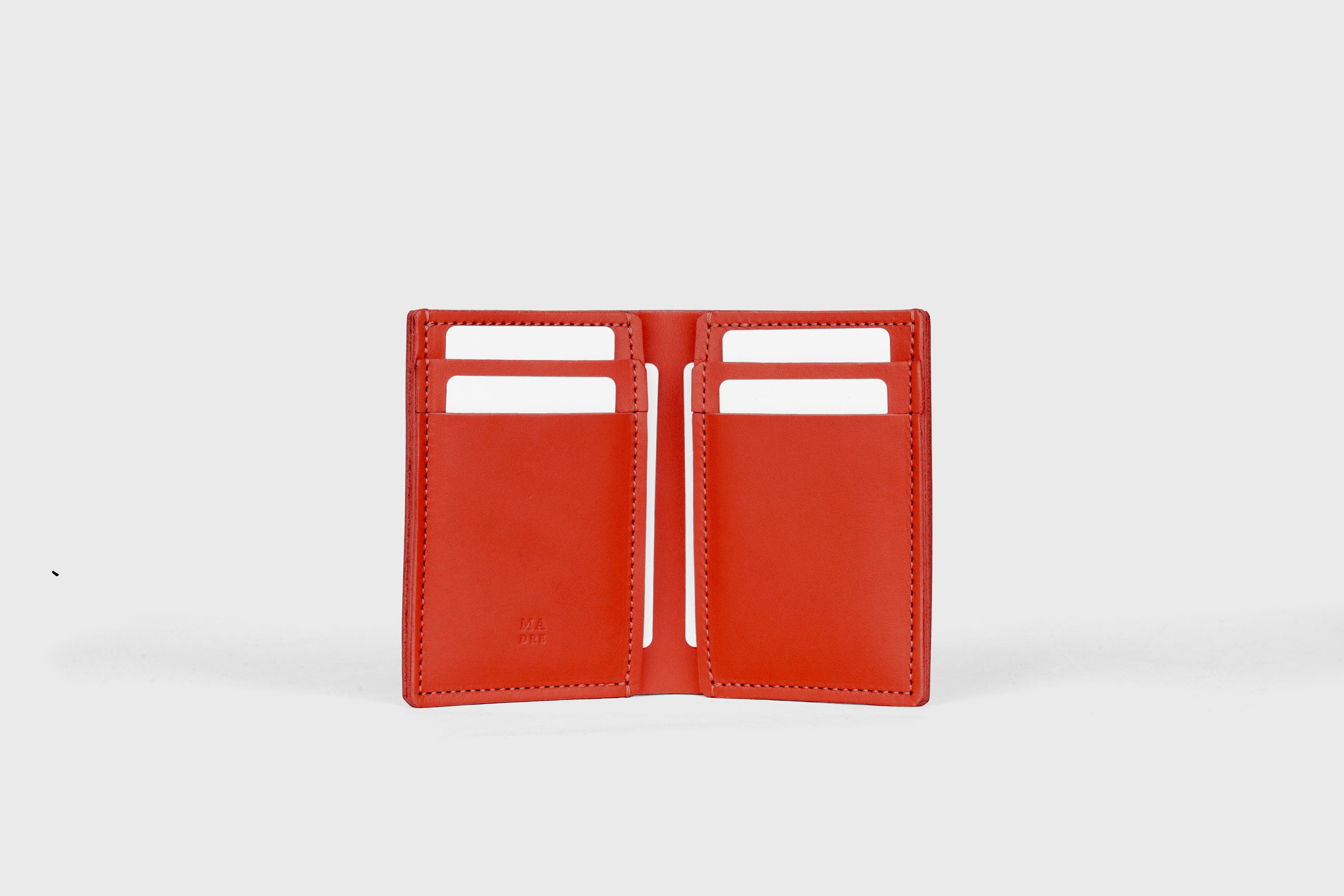 Bifold Wallet Vertical 6 Slots In Red Color In Vegetable Tanned Leather Minimalistic Design Atelier Madre Manuel Dreesmann Barcelona Spain