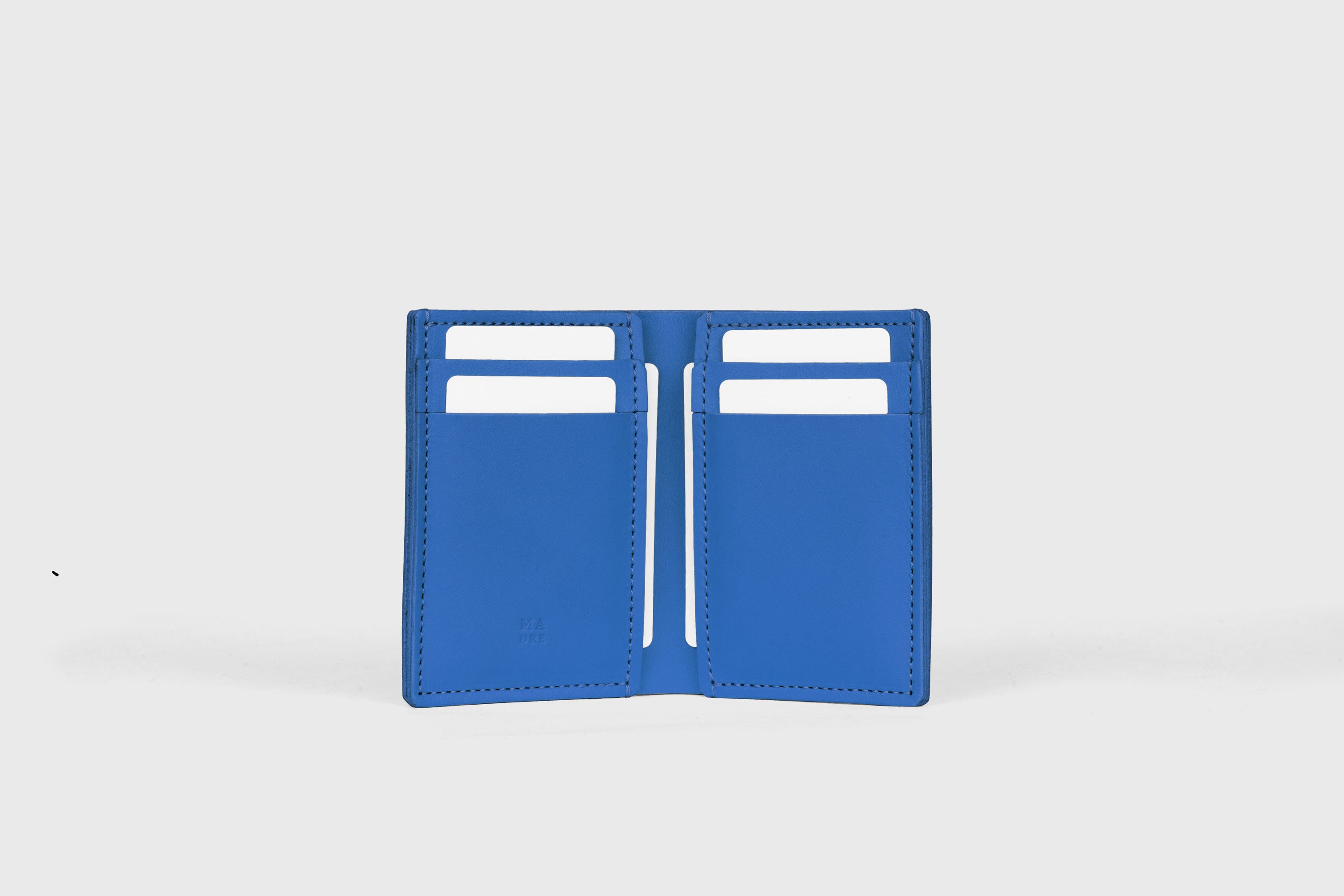 Bifold Wallet Vertical 6 Slots In Royal Blue Color In Vegetable Tanned Leather Minimalistic Design Atelier Madre Manuel Dreesmann Barcelona Spain
