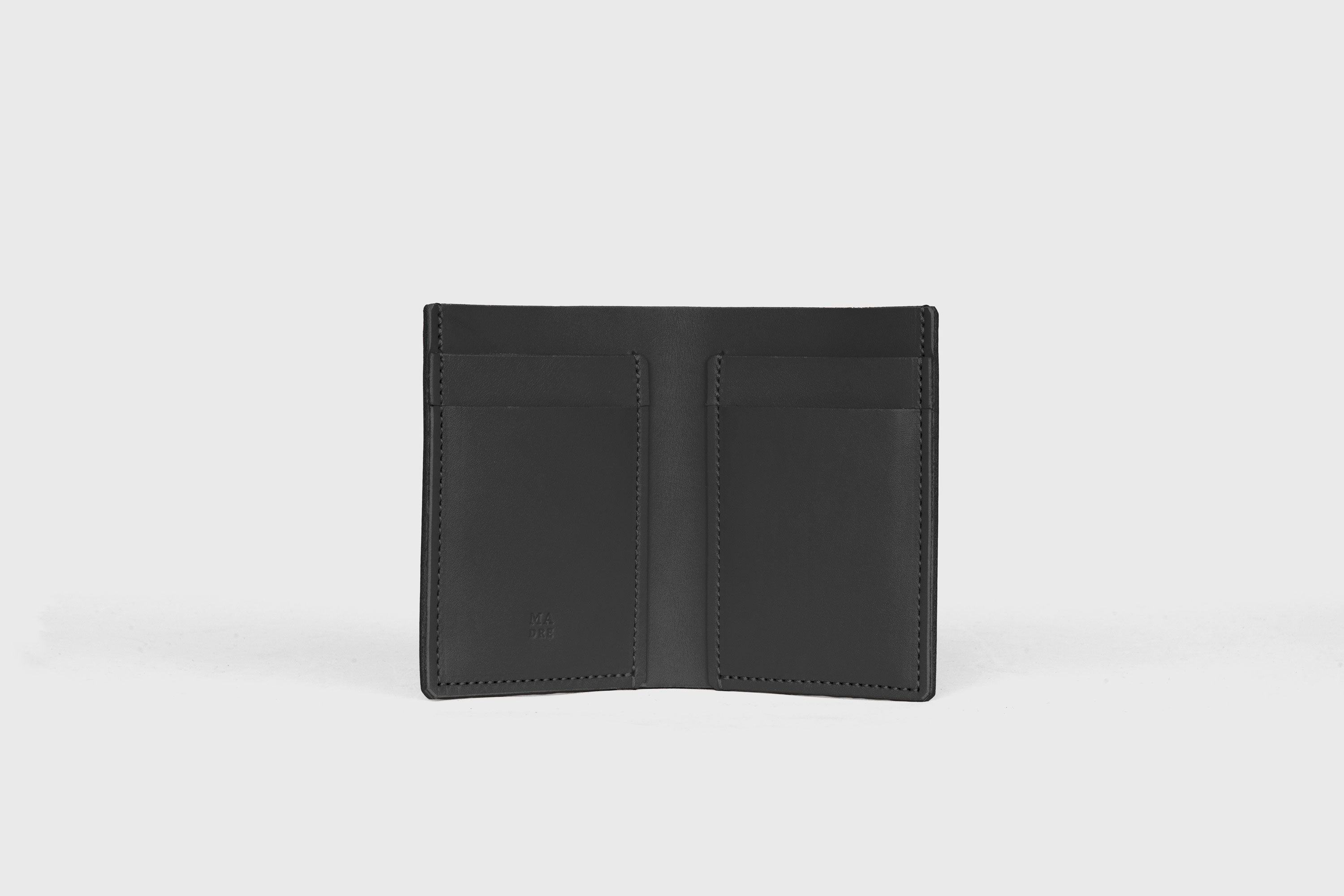 Bifold Wallet Vertical In Black Color In Vegetable Tanned Leather Minimalistic Slim Design Atelier Madre Manuel Dreesmann Barcelona Spain