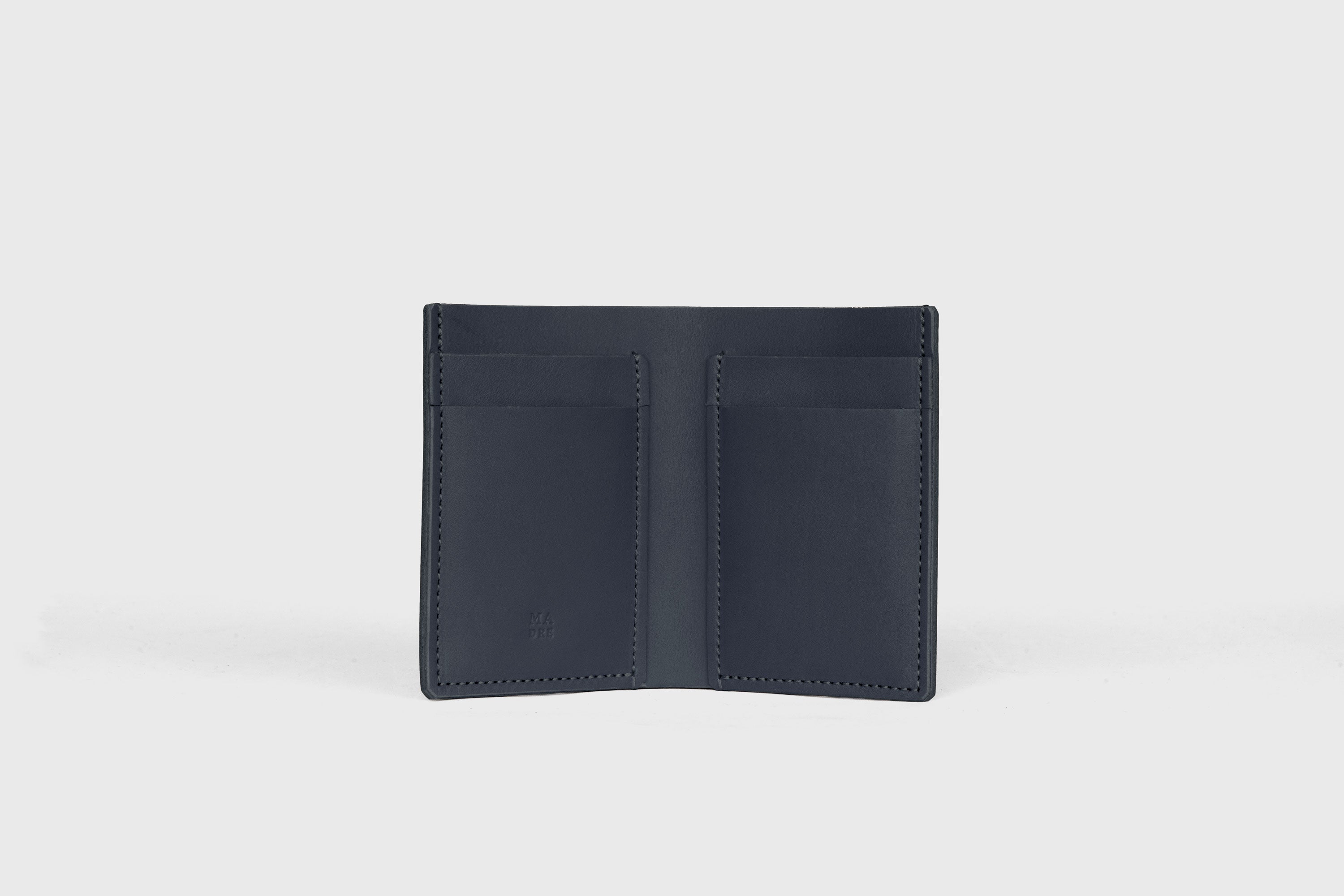 Bifold Wallet Vertical In Marine Blue Color In Vegetable Tanned Leather Minimalistic Slim Design Atelier Madre Manuel Dreesmann Barcelona Spain