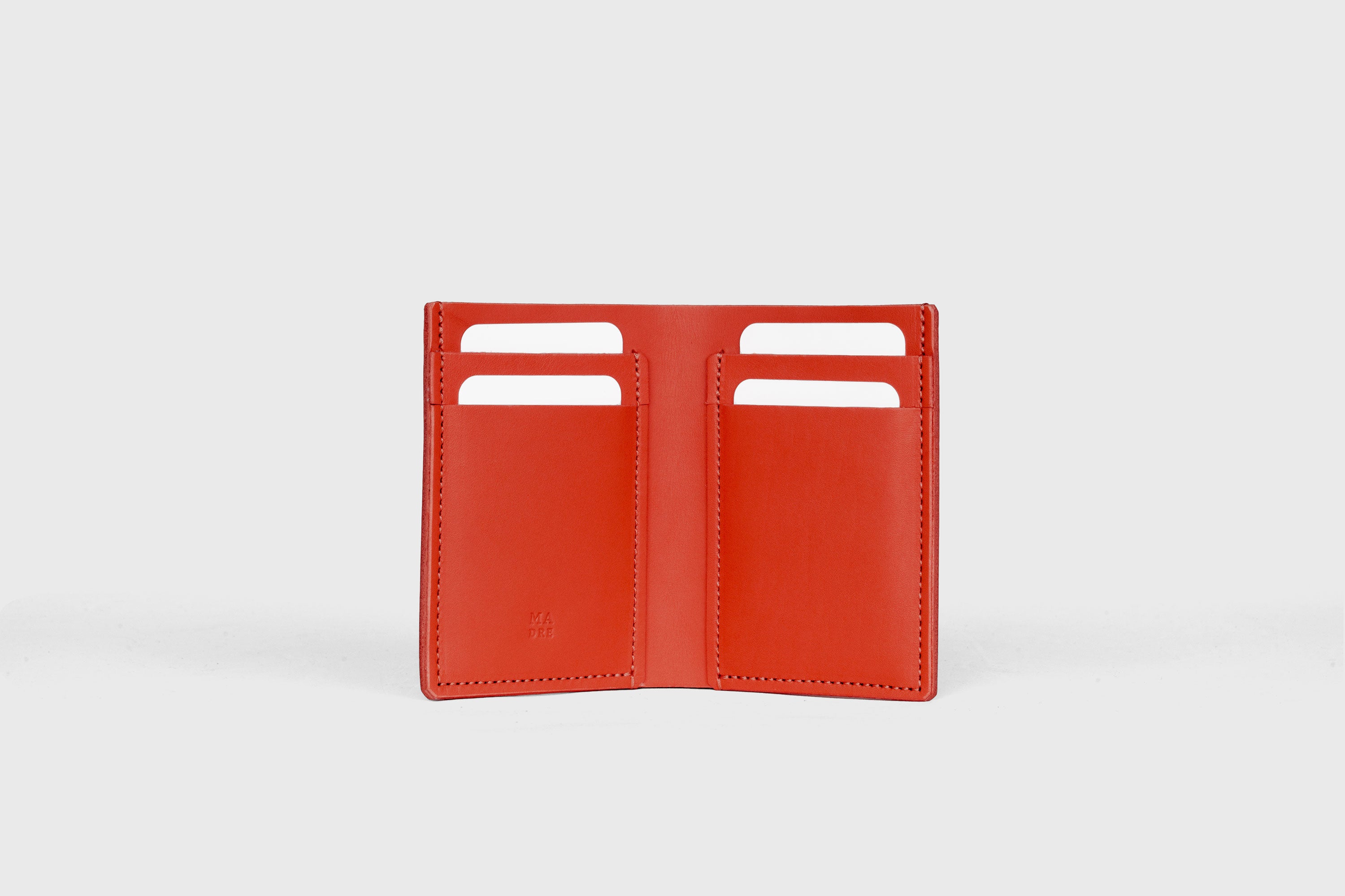 Bifold Wallet Vertical In Red Color In Vegetable Tanned Leather Minimalistic Slim Design Atelier Madre Manuel Dreesmann Barcelona Spain