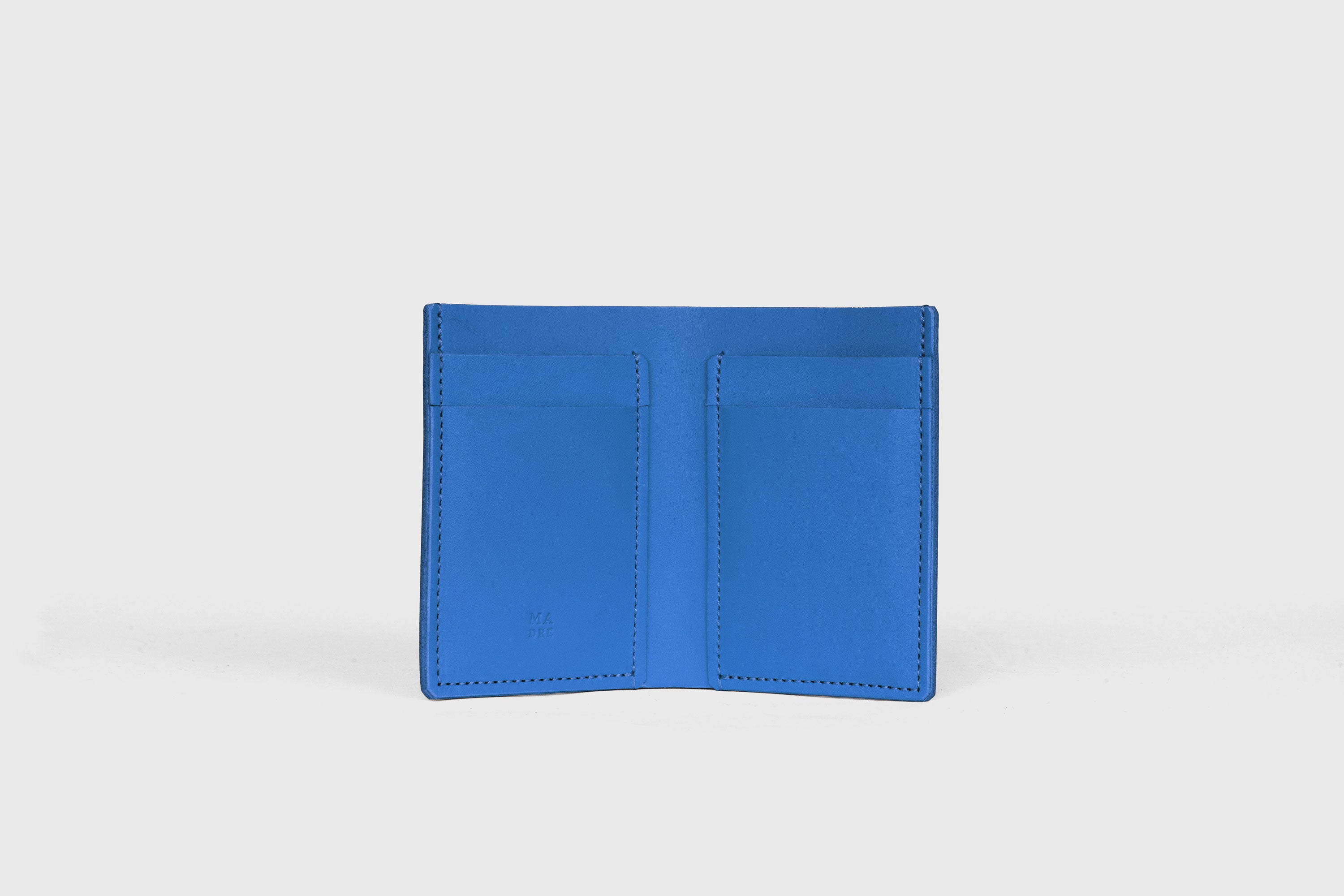 Bifold Wallet Vertical In Royal Blue Color In Vegetable Tanned Leather Minimalistic Slim Design Atelier Madre Manuel Dreesmann Barcelona Spain