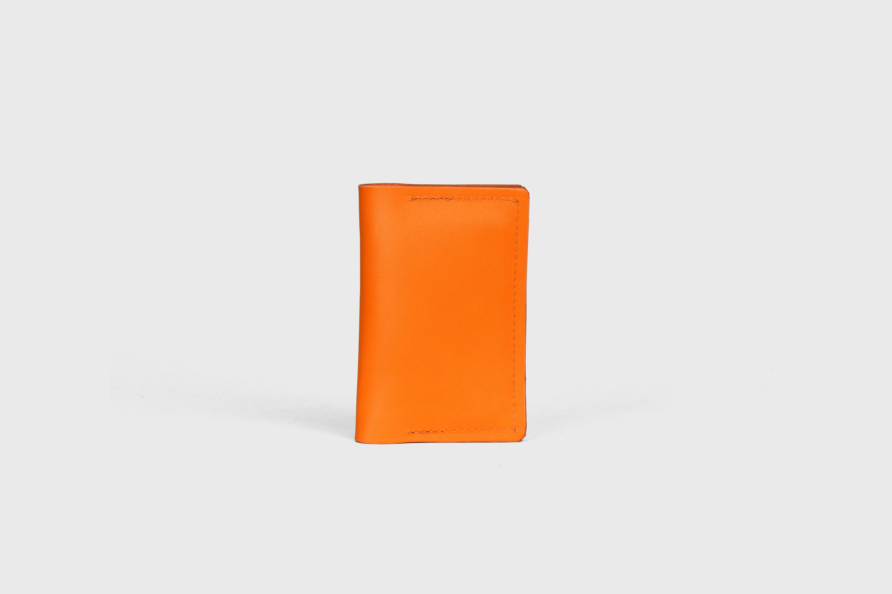 Card Etui In Orange Color In Vegetable Tanned Leather Minimalistic Design With Snap Buttons Atelier Madre Manuel Dreesmann Barcelona Spain