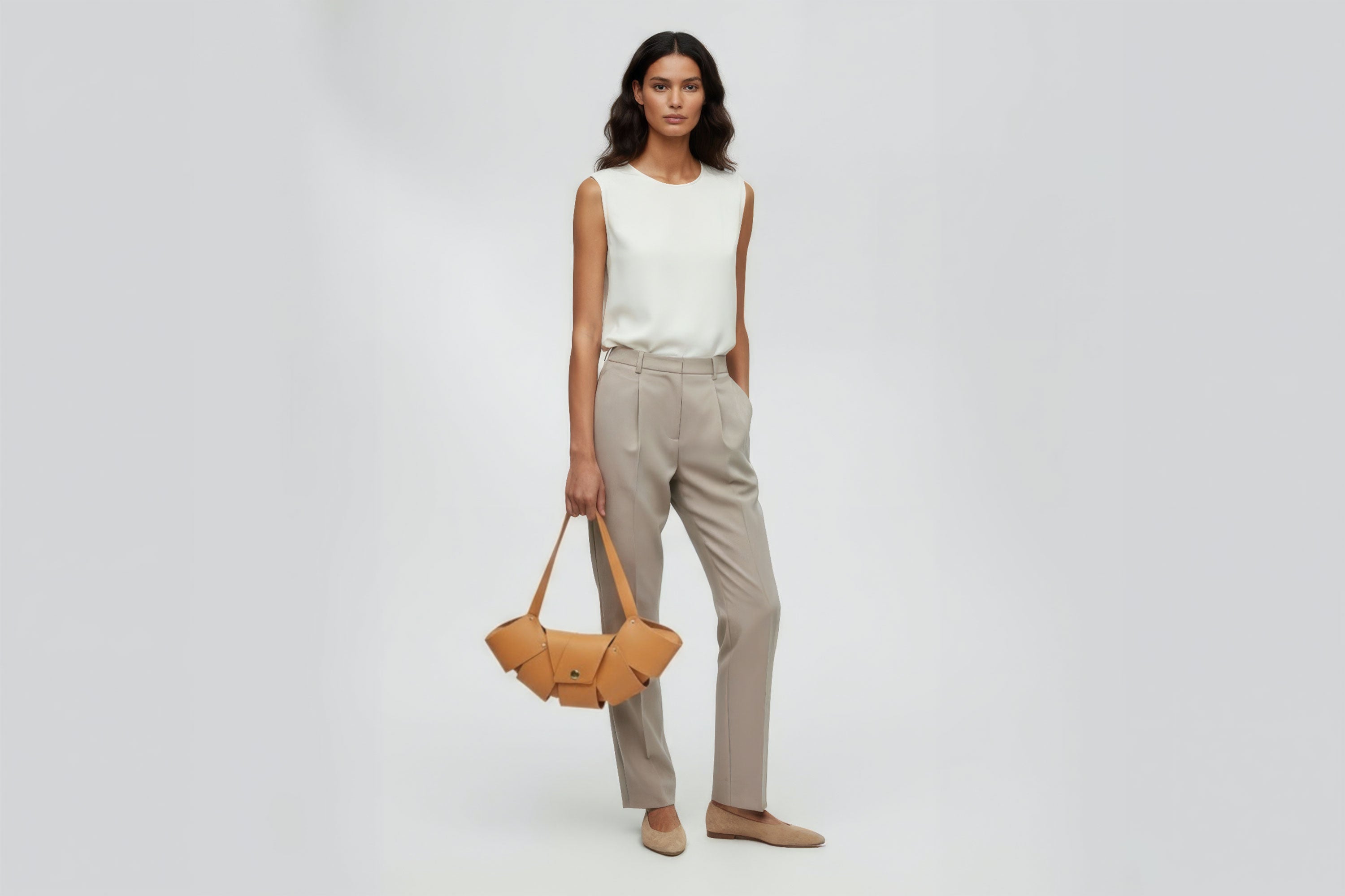 Croissant Bag Big Brown Leather Magnetic Closure On A Woman Model Full Grain Vegetable Tanned Leather High Quality Modern Minimalistic Organic Design Full Brass Rivets Atelier Madre Manuel Dreesmann Barcelona Spain