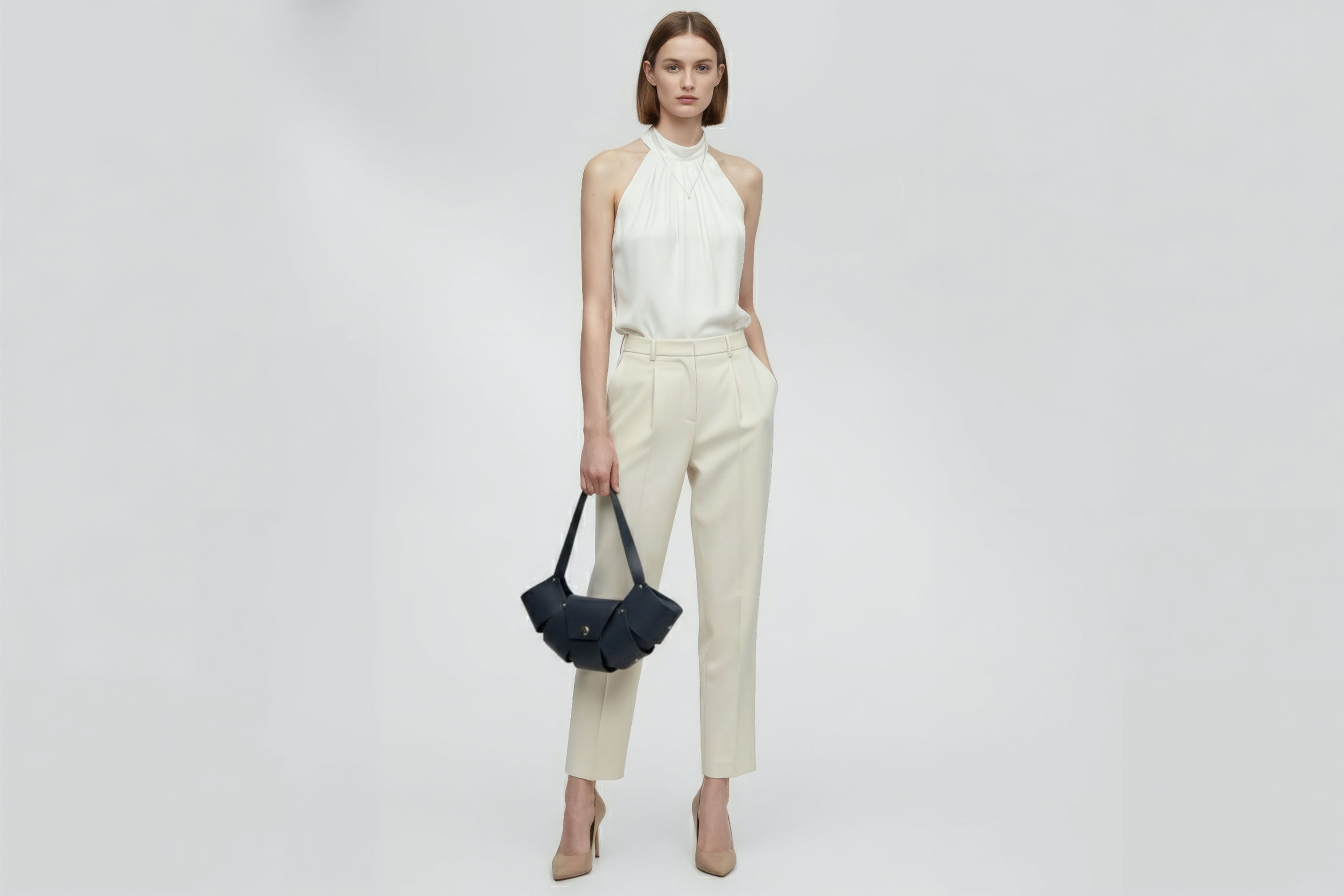 Croissant Bag Big Marine Blue Leather Magnetic Closure On A Woman Model Full Grain Vegetable Tanned Leather High Quality Modern Minimalistic Organic Design Full Brass Rivets Atelier Madre Manuel Dreesmann Barcelona Spain