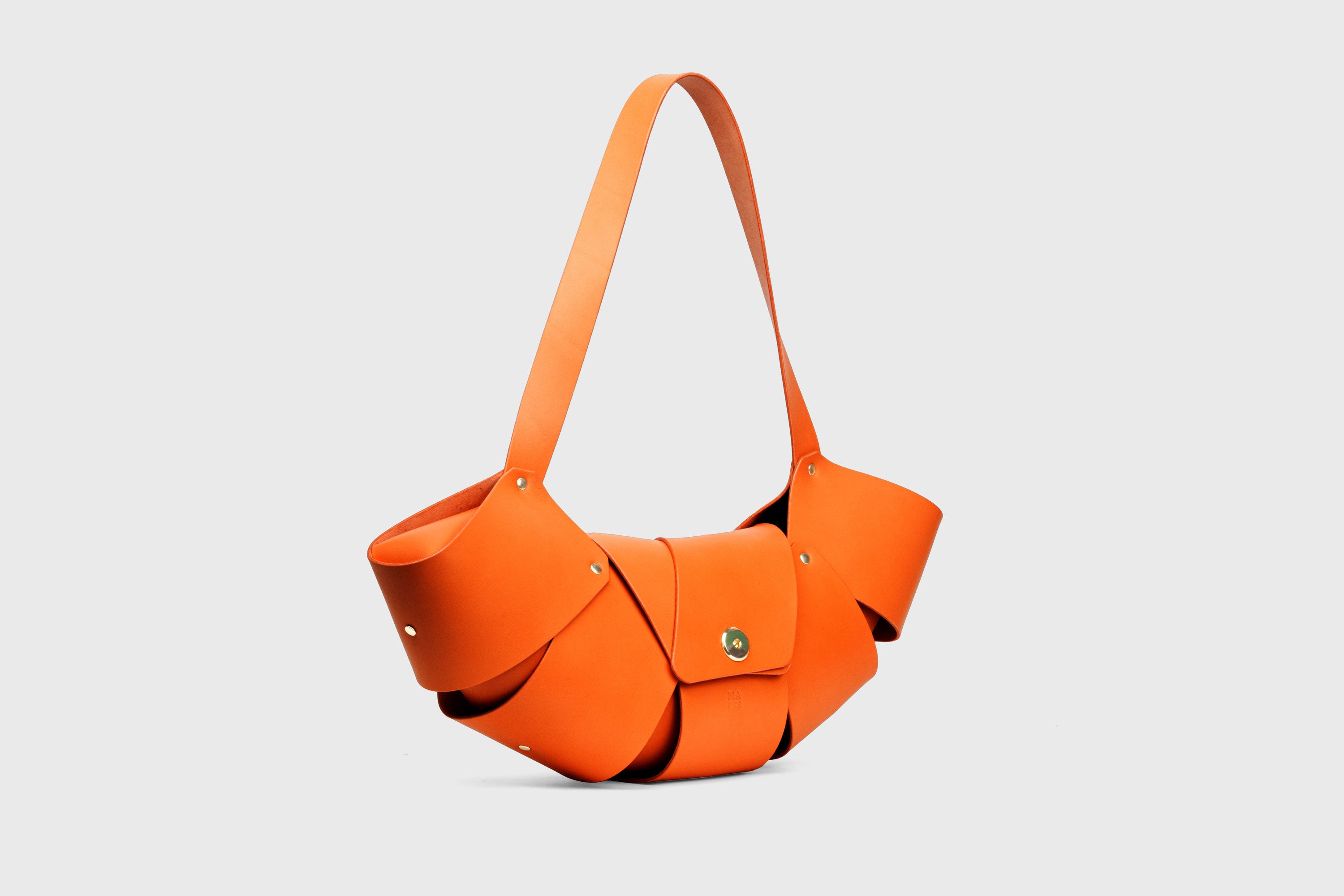 Croissant Bag Big Orange Leather Magnetic Closure Full Grain Vegetable Tanned Leather High Quality Modern Minimalistic Organic Design Full Brass Rivets Atelier Madre Manuel Dreesmann Barcelona Spain
