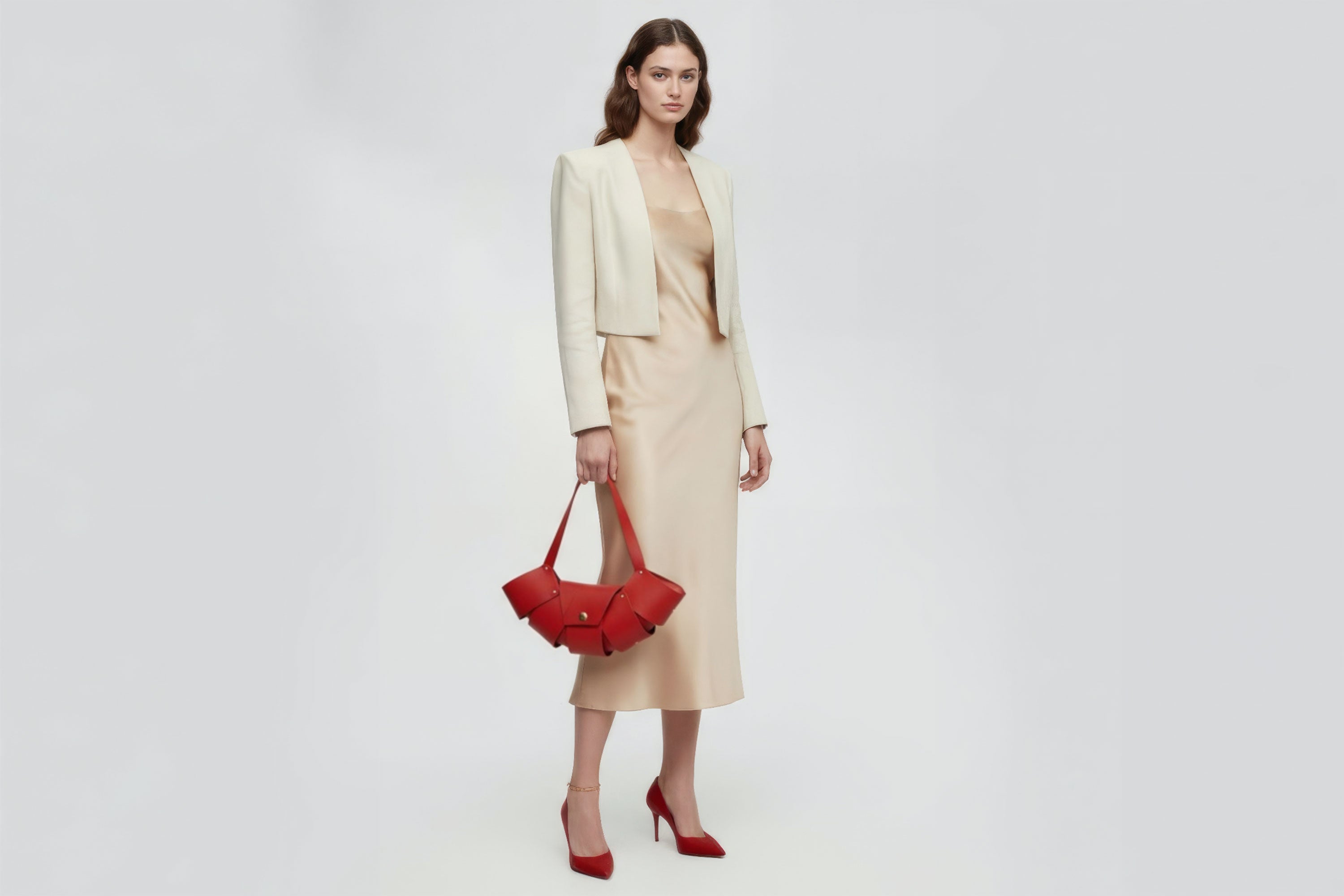 Croissant Bag Big Red Colour Leather Magnetic Closure On A Woman Model Full Grain Vegetable Tanned Leather High Quality Modern Minimalistic Organic Design Full Brass Rivets Atelier Madre Manuel Dreesmann Barcelona Spain