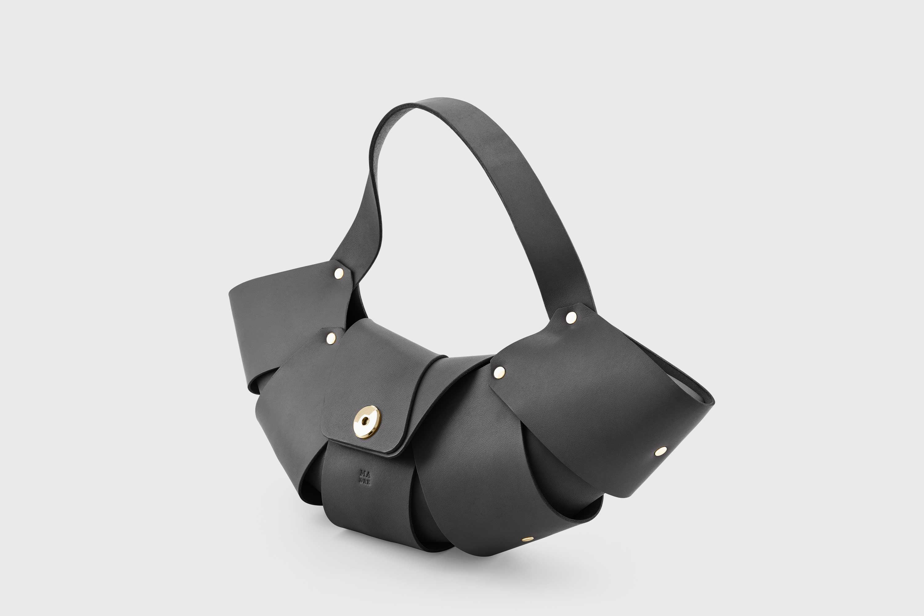 Croissant Bag Black Color Leather Magnetic Closure Full Grain Vegetable Tanned Leather High Quality Modern Minimalistic Organic Design Full Brass Rivets Atelier Madre Manuel Dreesmann Barcelona Spain