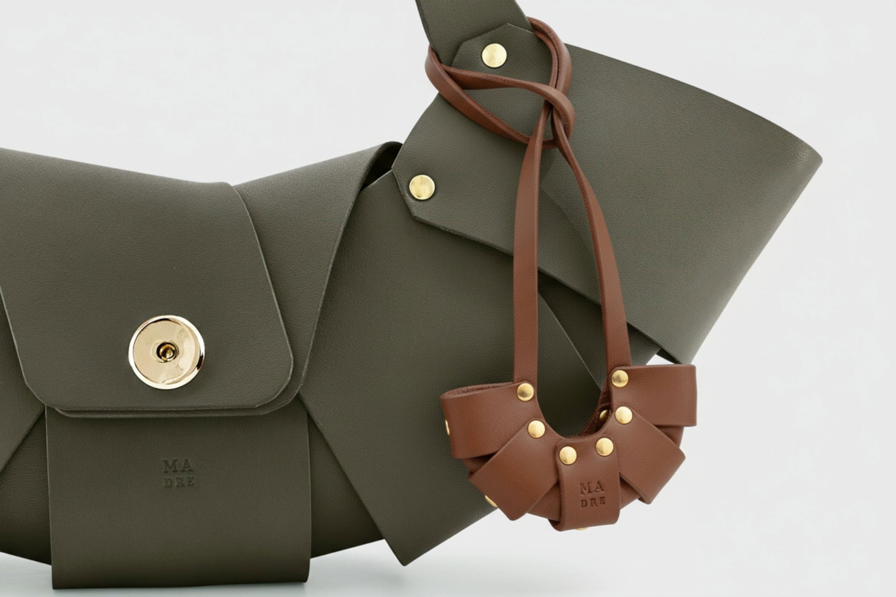 Dark Brown Color Leather Croissant Bag Charm Minimal Premium Design on Olive Green Croissant Bag attached Atelier Madre Manuel Dreesmann Barcelona Spain