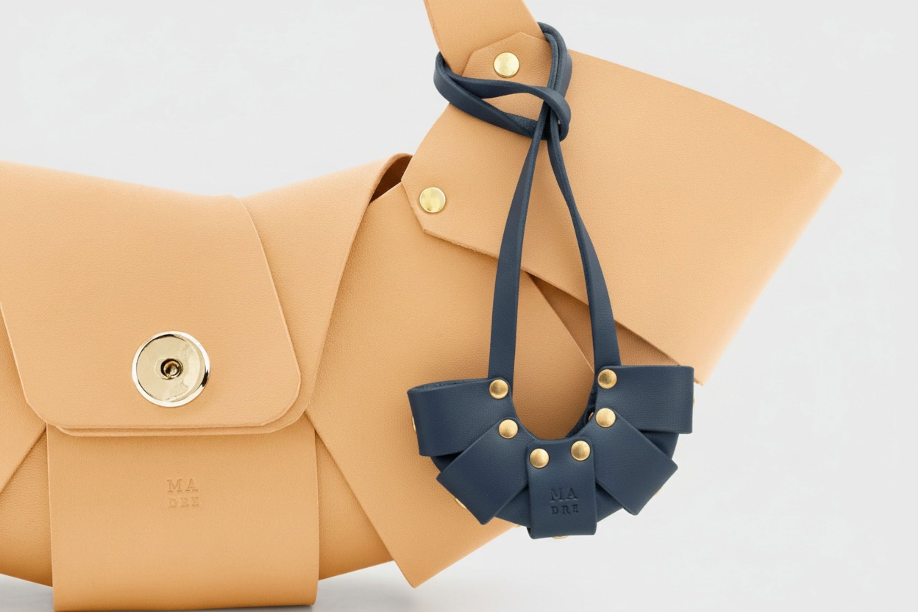 Marine Blue Color Leather Croissant Bag Charm Minimal Premium Design Attached on Brwon Croissant Bag Atelier Madre Manuel Dreesmann Barcelona Spain