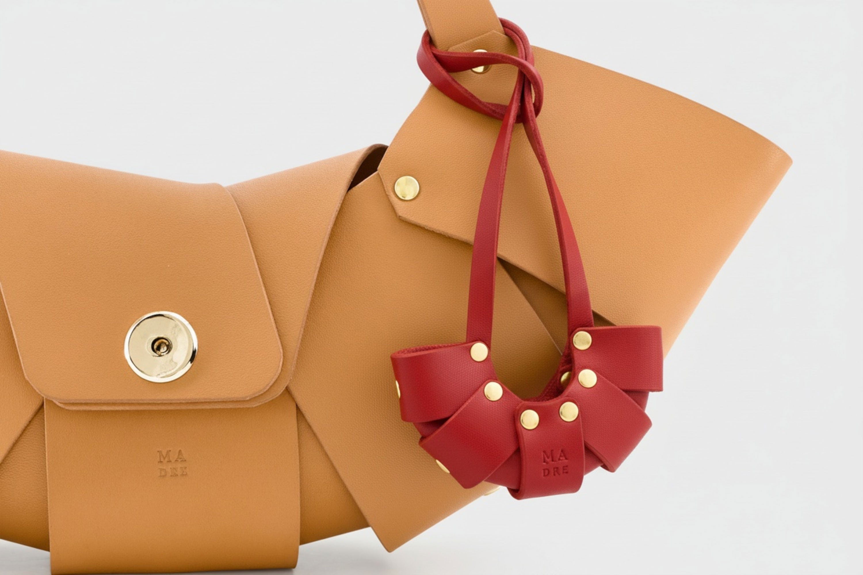 Red Color Leather Croissant Bag Charm Minimal Premium Design Attached on Brown Croissant Bag Atelier Madre Manuel Dreesmann Barcelona Spain