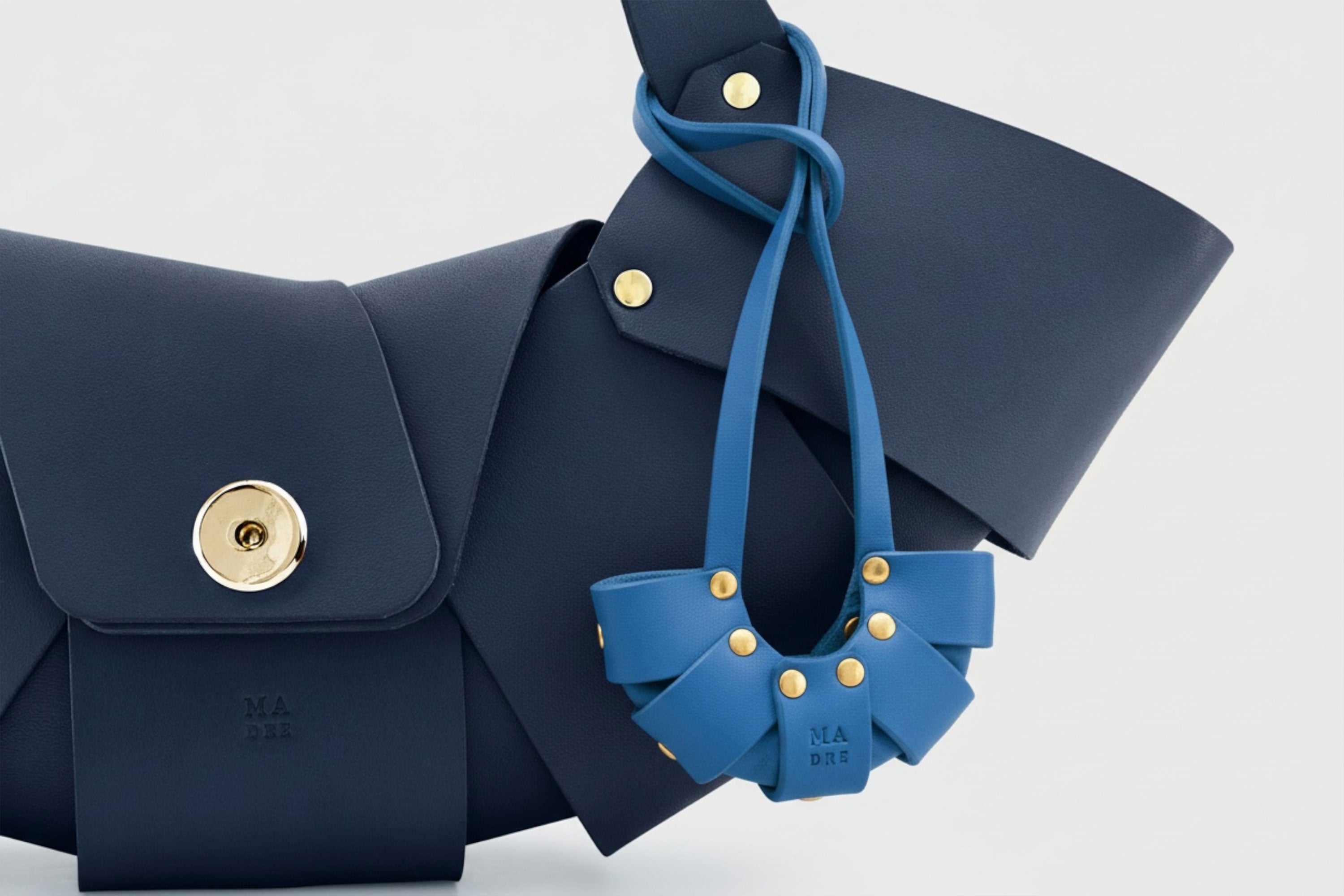 Royal Blue Color Leather Croissant Bag Charm Minimal Premium Design Attached on Marine Blue Croissant Bag Atelier Madre Manuel Dreesmann Barcelona Spain