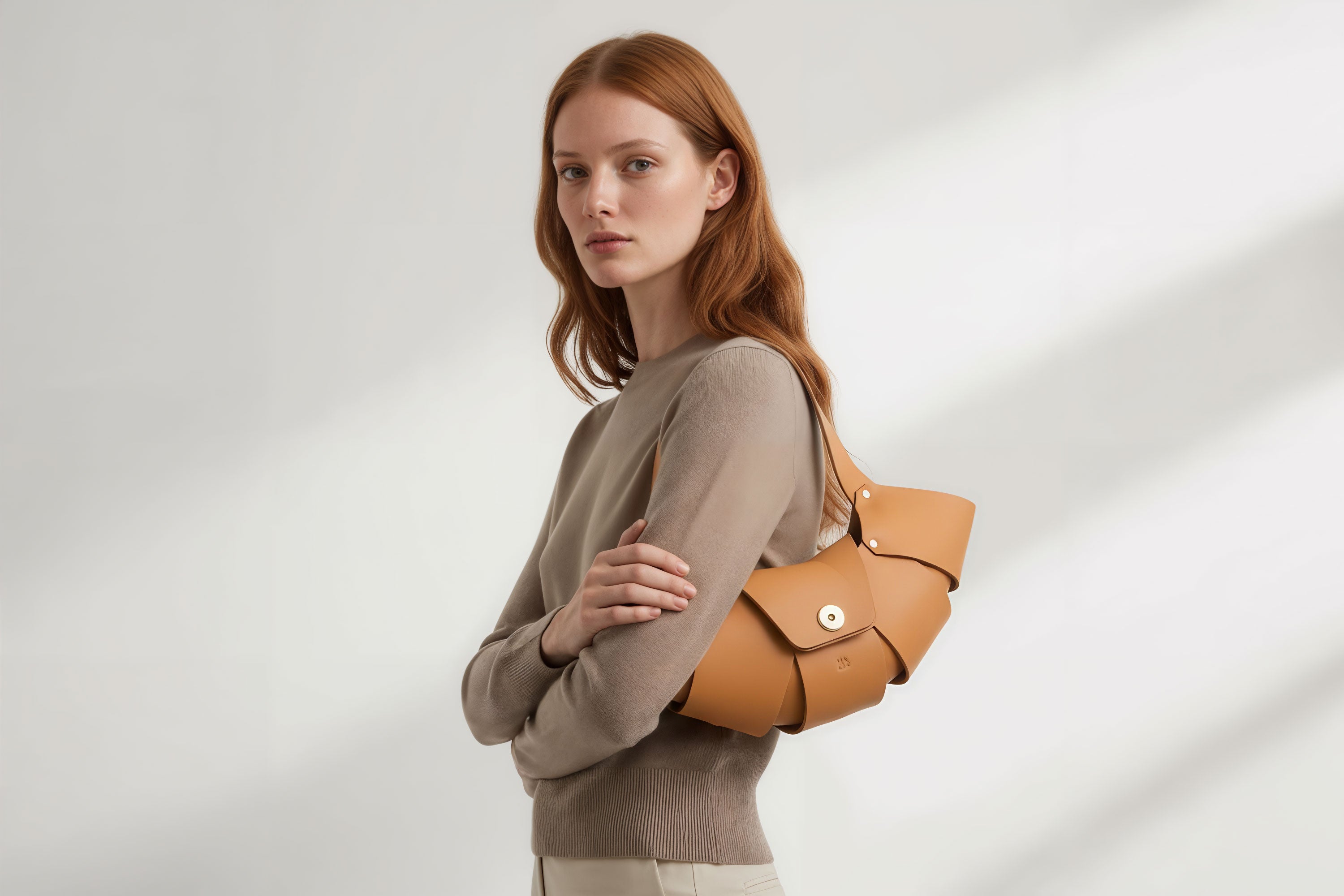 Croissant Bag Brown Color Leather Minimalistic Design On Model White Background Atelier Madre Manuel Dreesmann Barcelona