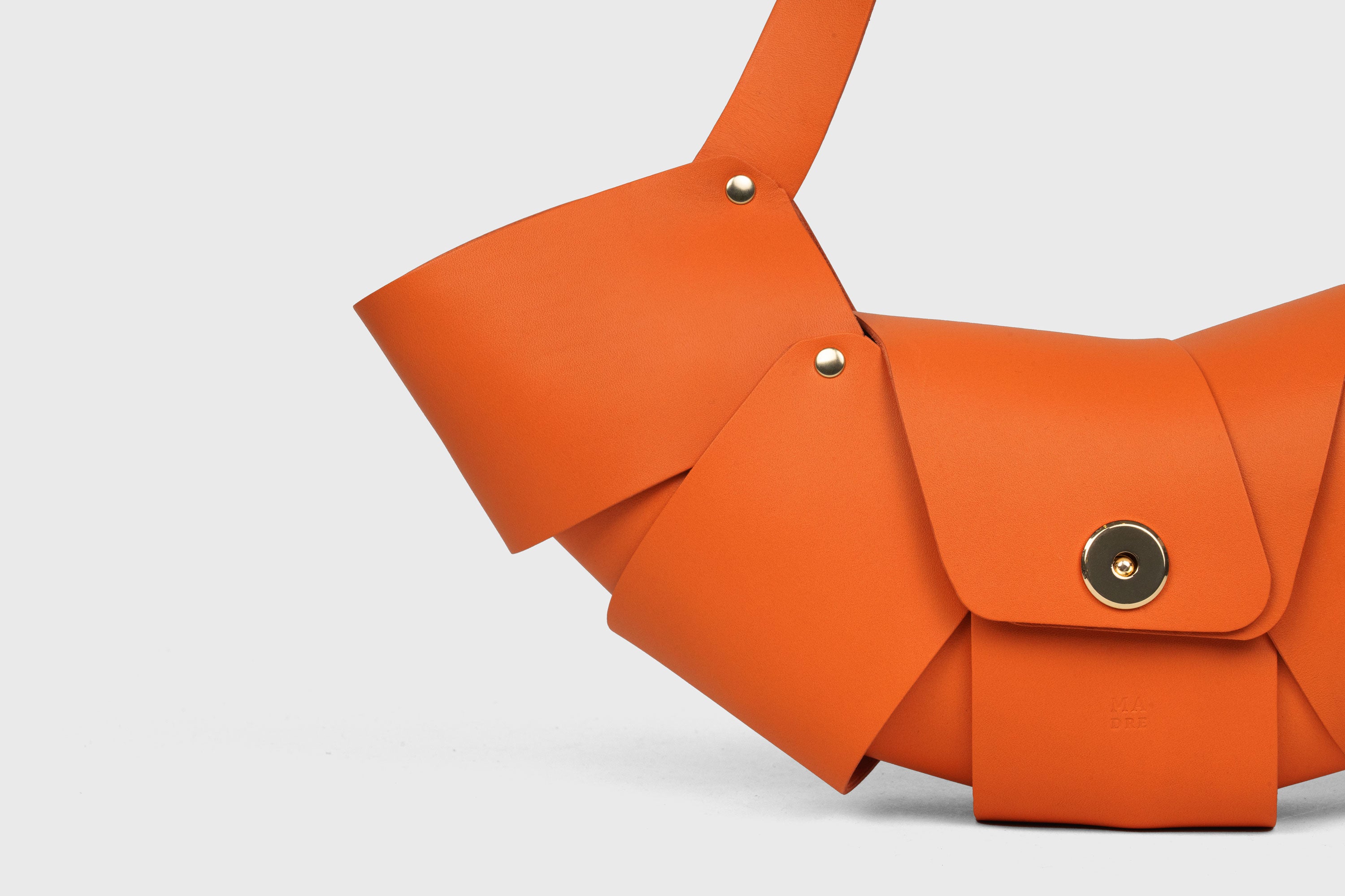 Croissant Bag Orange Color Leather Magnetic Closure Full Grain Vegetable Tanned Leather High Quality Modern Minimalistic Organic Design Full Brass Rivets Atelier Madre Manuel Dreesmann Barcelona Spain