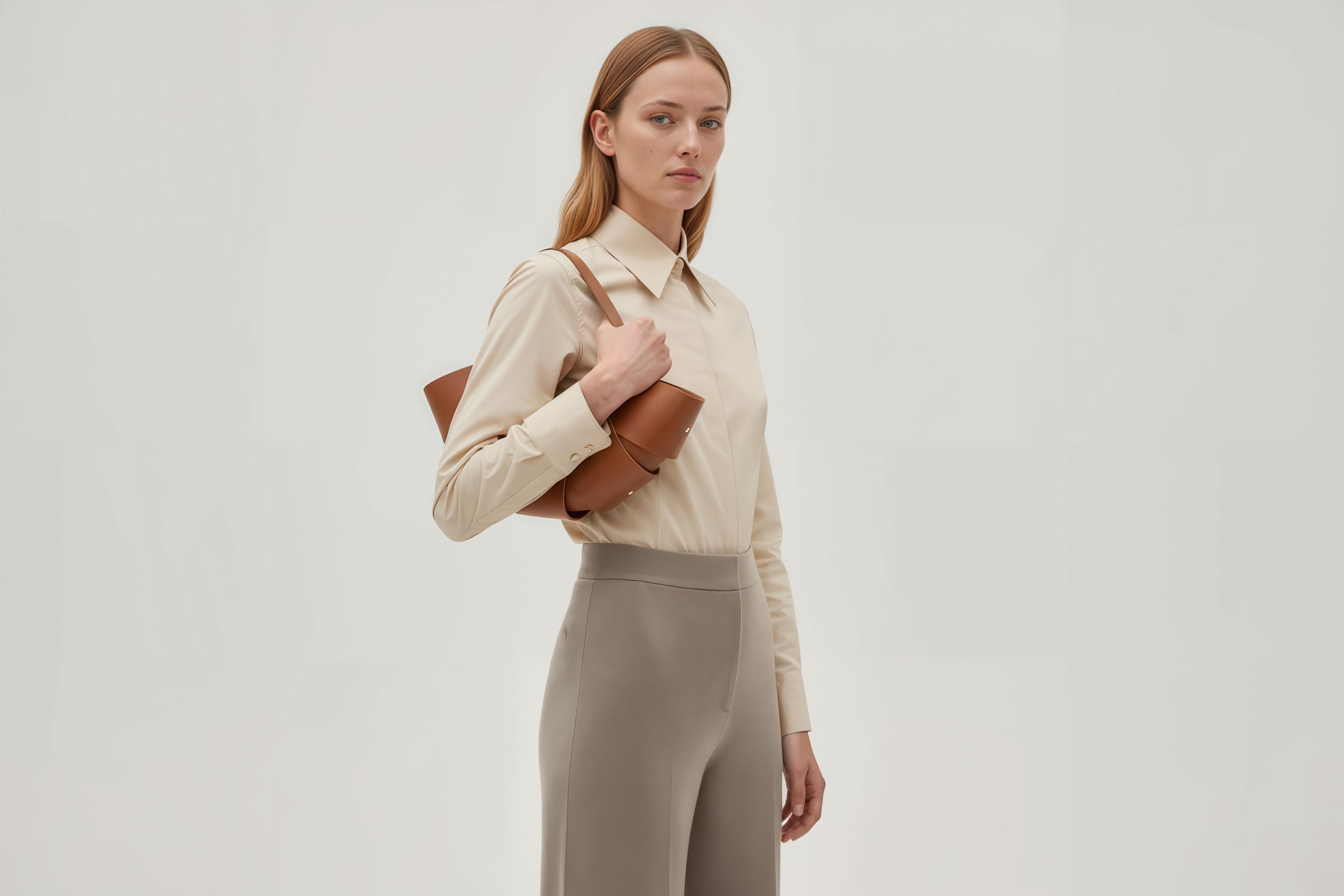 Croissant Bag Dark Brown Color Leather Minimalistic Design On Model White Background Atelier Madre Manuel Dreesmann Barcelona