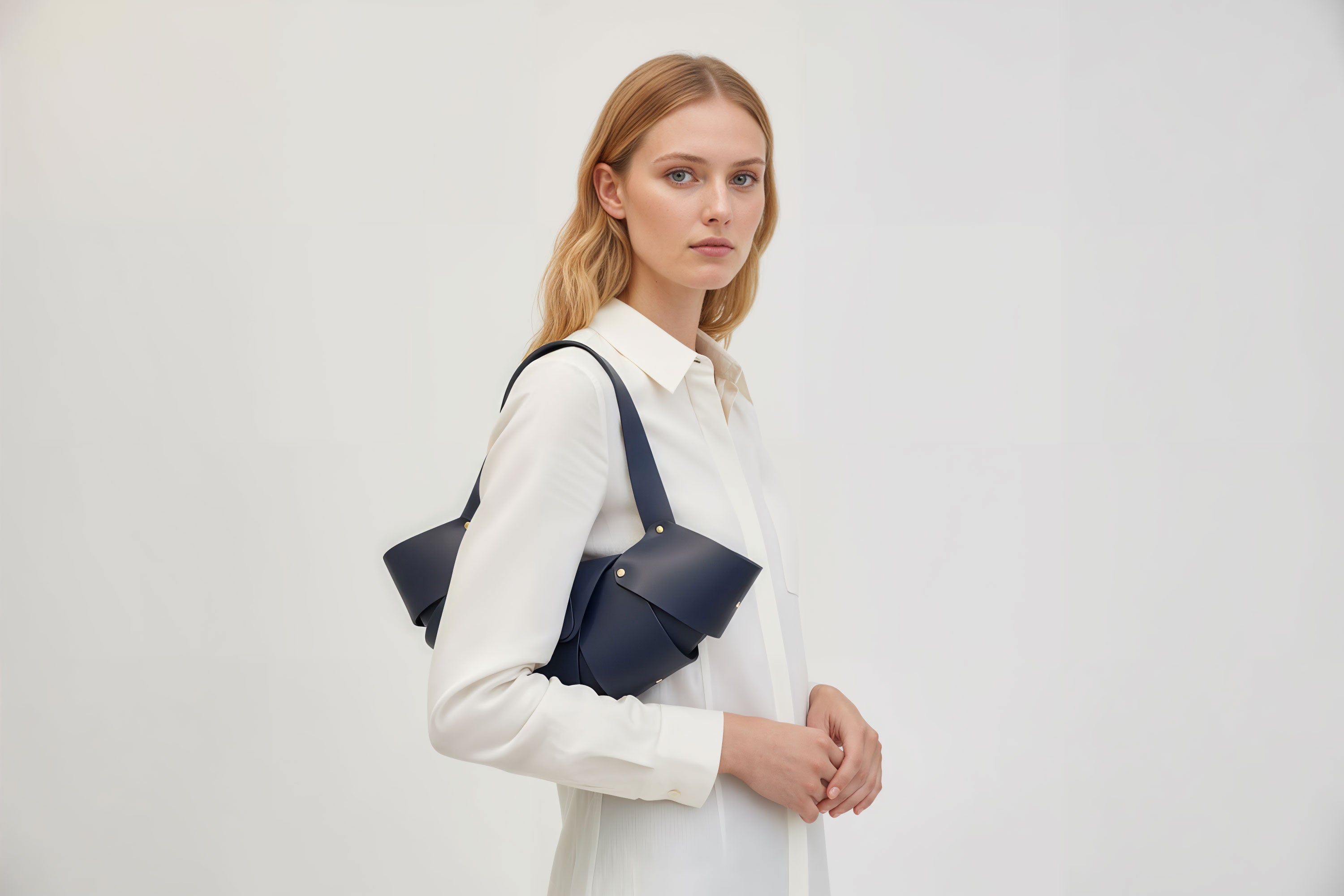 Croissant Bag Marine Blue Color Leather Minimalistic Design On Model White Background Atelier Madre Manuel Dreesmann Barcelona