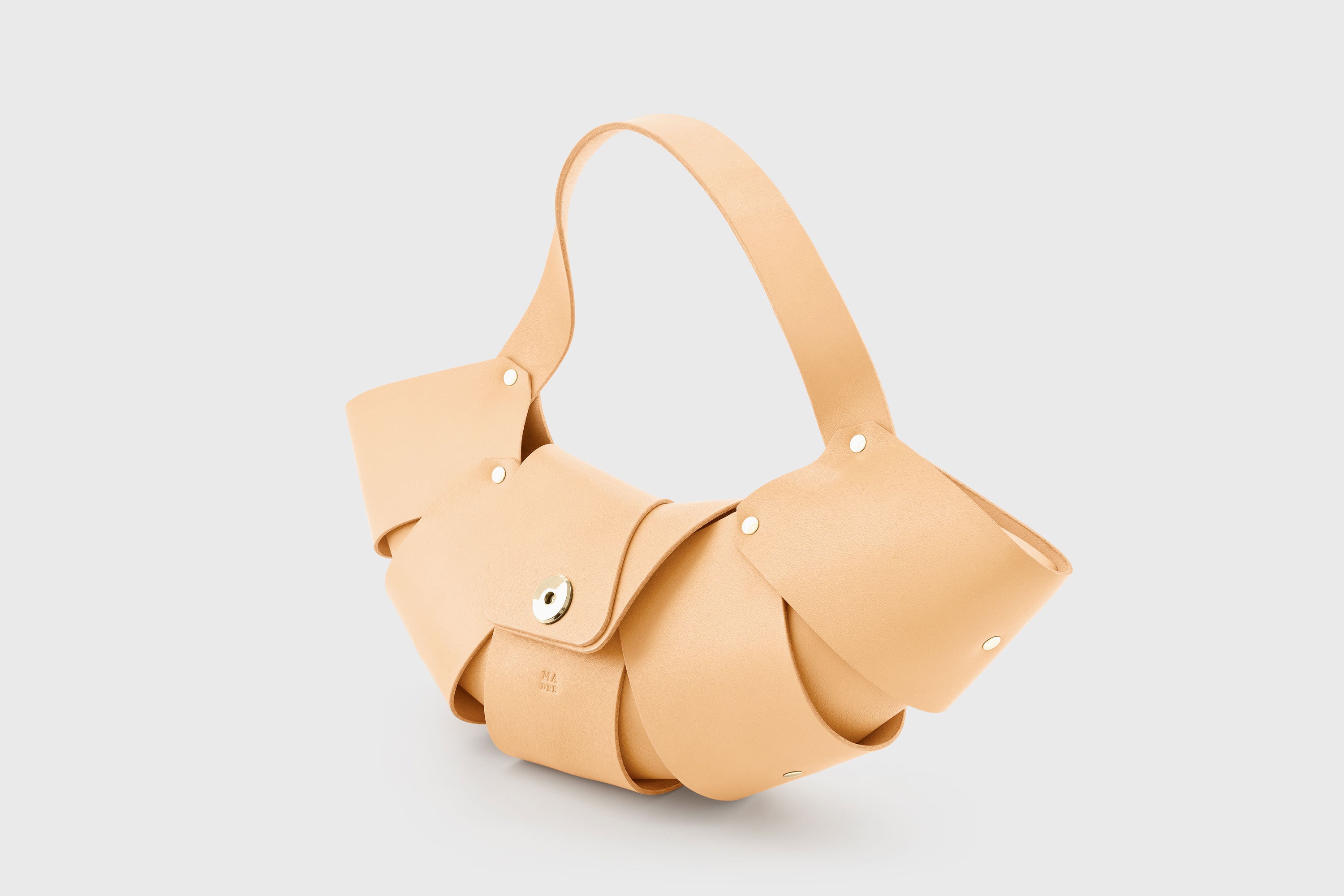 Croissant Bag Natural Leather Magnetic Closure Full Grain Vegetable Tanned Leather High Quality Modern Minimalistic Organic Design Full Brass Rivets Atelier Madre Manuel Dreesmann Barcelona Spain