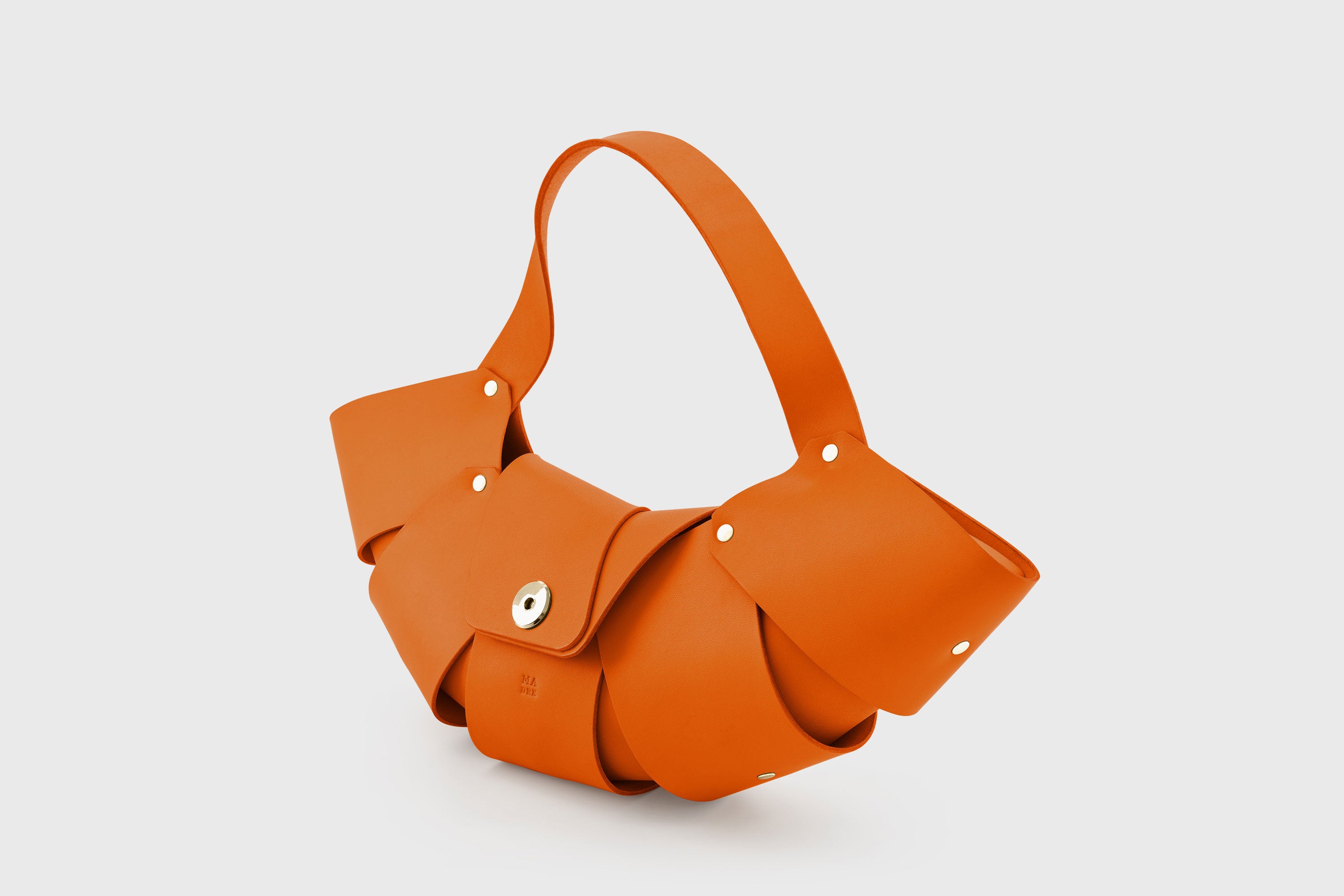 Croissant Bag Orange Color Leather Magnetic Closure Full Grain Vegetable Tanned Leather High Quality Modern Minimalistic Organic Design Full Brass Rivets Atelier Madre Manuel Dreesmann Barcelona Spain