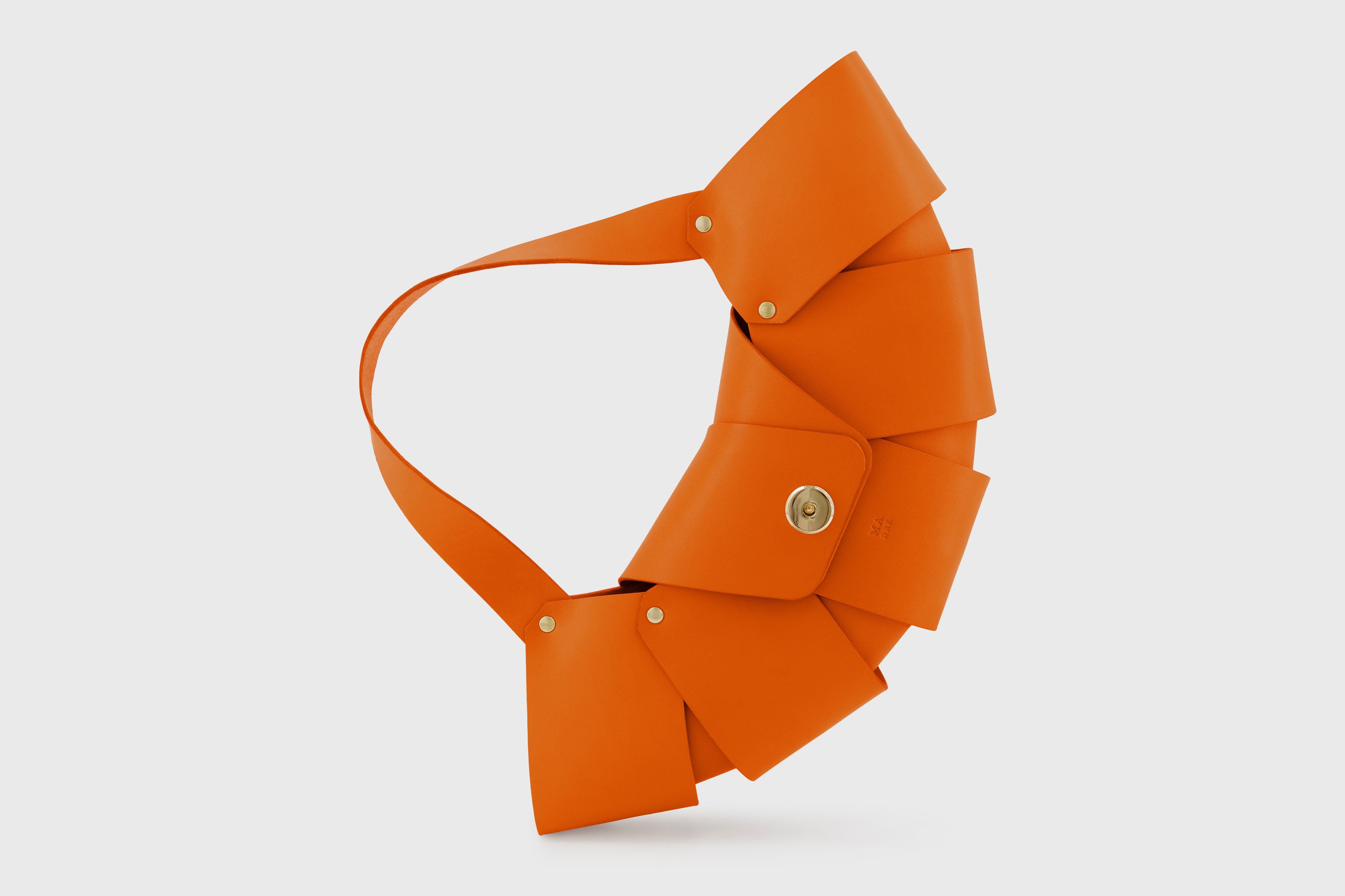 Croissant Bag Orange Color Leather Magnetic Closure Full Grain Vegetable Tanned Leather High Quality Modern Minimalistic Organic Design Full Brass Rivets Atelier Madre Manuel Dreesmann Barcelona Spain