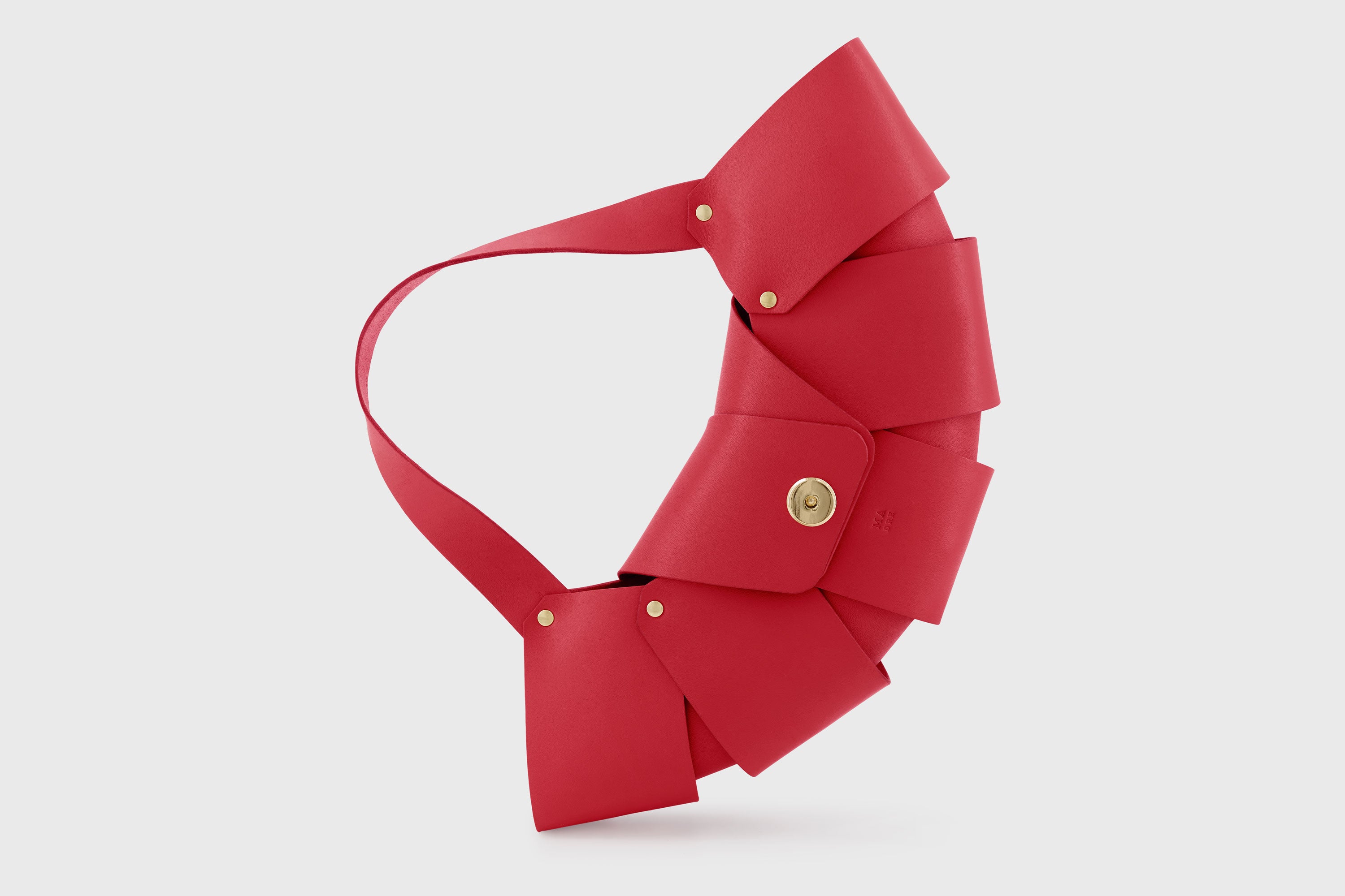 Croissant Bag Red Color Leather Magnetic Closure Full Grain Vegetable Tanned Leather High Quality Modern Minimalistic Organic Design Full Brass Rivets Atelier Madre Manuel Dreesmann Barcelona Spain