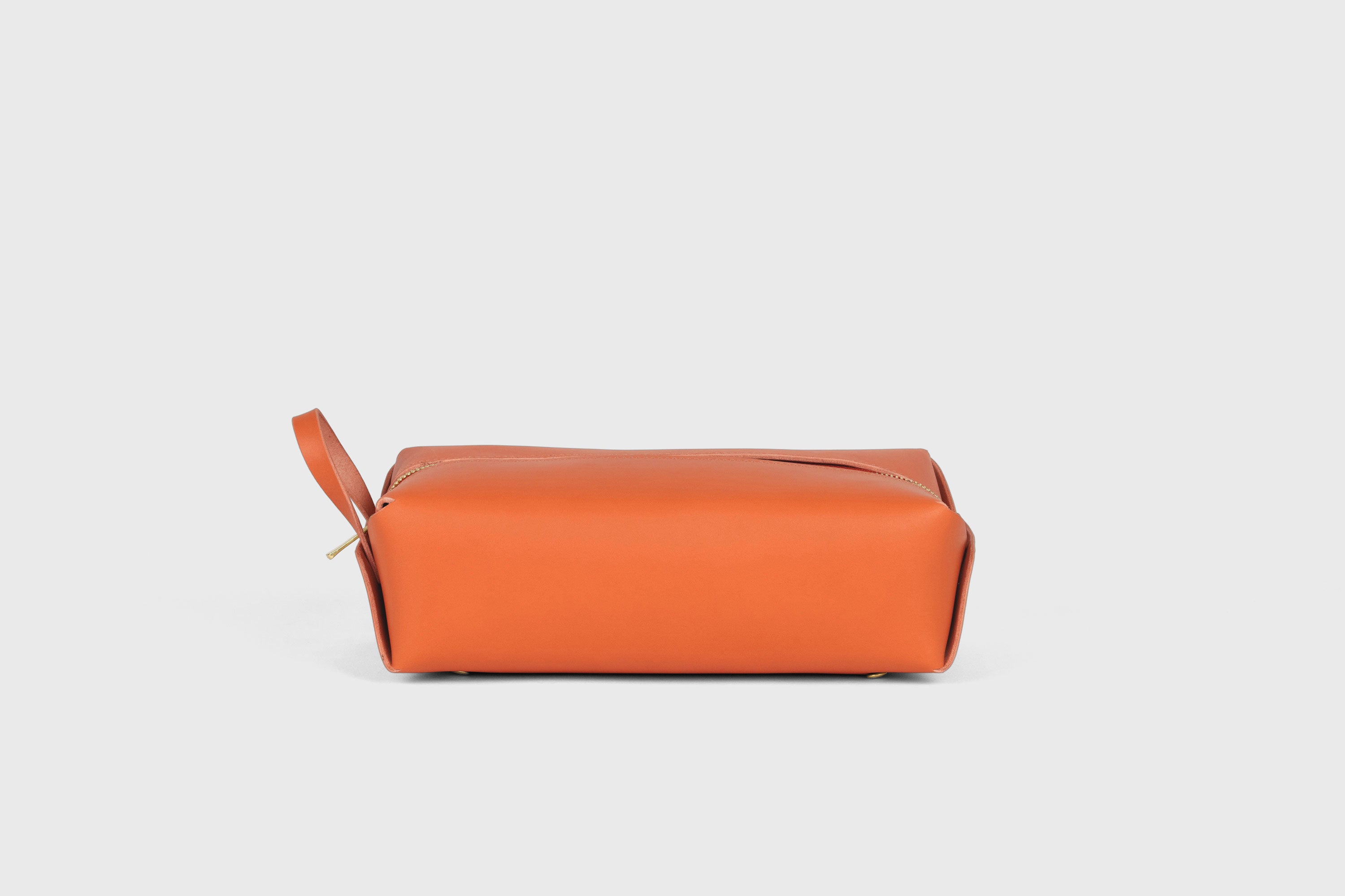 Dopp Kit Orange Color Leather Toiletry Bag Make Up Pouch Travel Pack Hygiene Bag Zipper Premium Quality Minimalistic Modern Design Atelier Madre Manuel Dreesmann Barcelona Spain