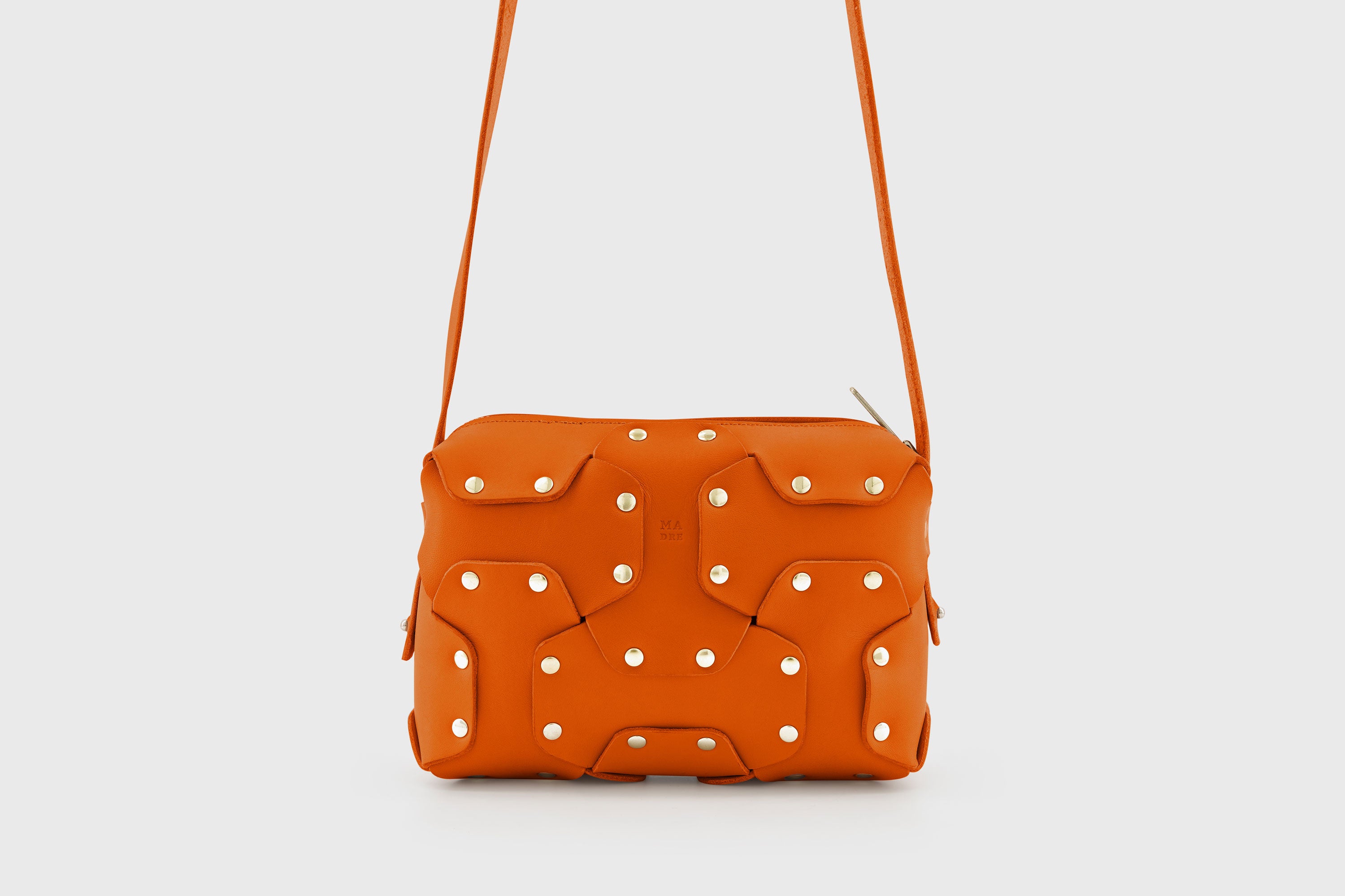 Double Rivet Bag Orange Color Leather Full Grain Vegetable Tanned Leather Modern Minimalist Design Premium Quality Full Brass Clutch Crossbody Shoulder Bag Atelier Madre Manuel Dreesmann Barcelona Spain