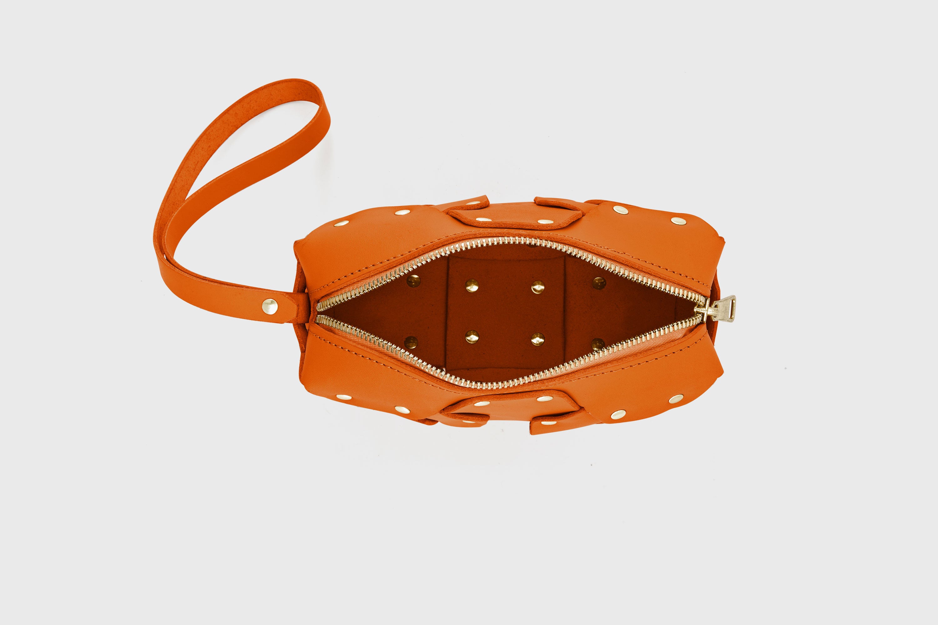 Double Rivet Bag Orange Color Leather Full Grain Vegetable Tanned Leather Modern Minimalist Design Premium Quality Full Brass Clutch Crossbody Shoulder Bag Atelier Madre Manuel Dreesmann Barcelona Spain
