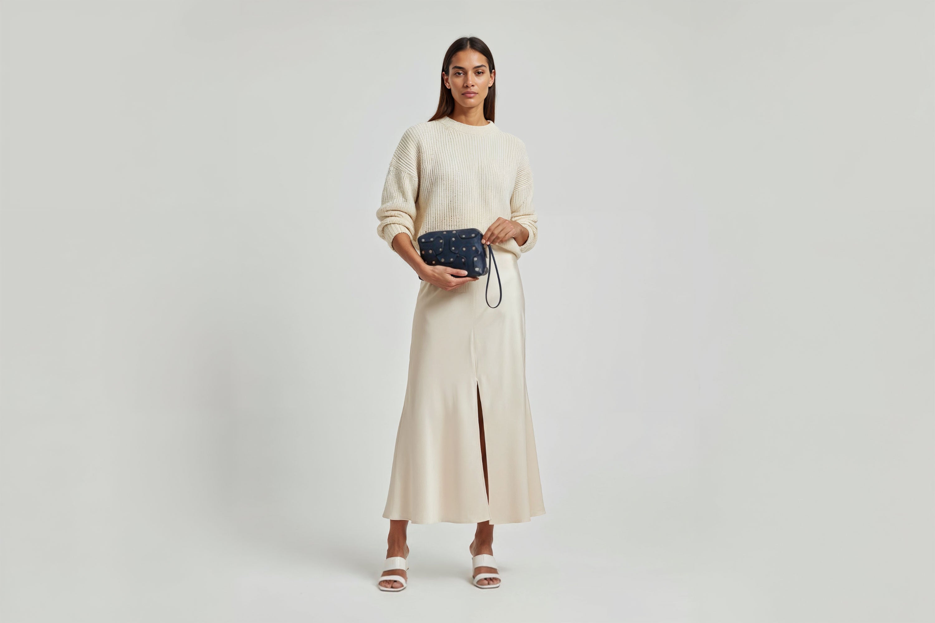 Double Rivet Bag Blue Color On A Woman Model Leather Full Grain Vegetable Tanned Leather Modern Minimalist Design Premium Quality Full Brass Clutch Crossbody Shoulder Bag Atelier Madre Manuel Dreesmann Barcelona Spain