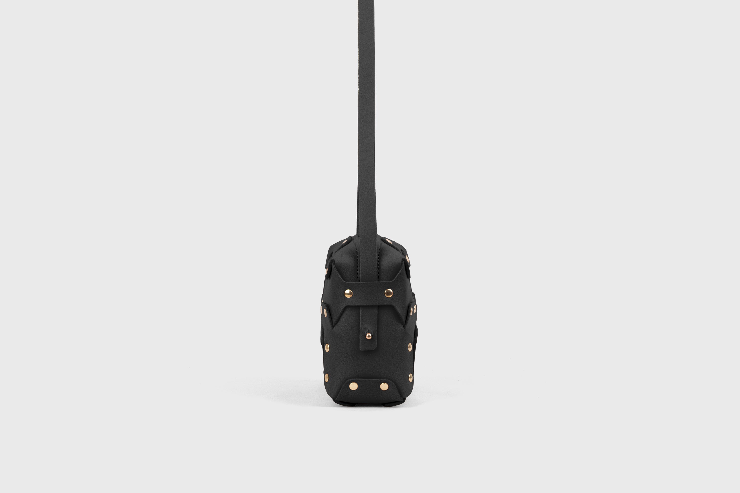 Double Rivet Bag, Black Color, Leather Full Grain Vegetable Tanned Leather Modern Minimalist Design Premium Quality Full Brass Clutch Crossbody Shoulder Bag from Atelier Madre, Manuel Dreesmann Barcelona Spain