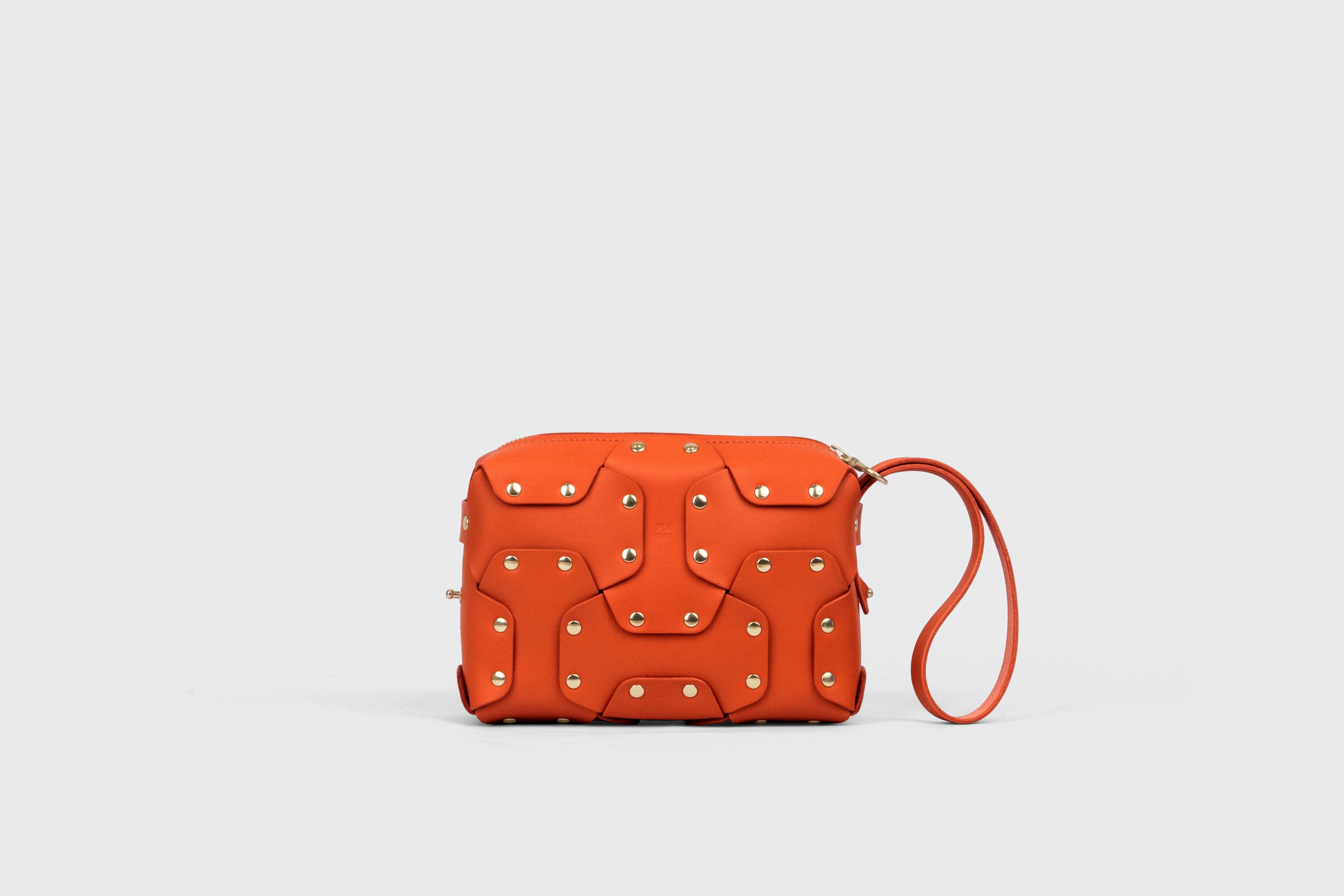 Double Rivet Bag, Orange Color, Leather Full Grain Vegetable Tanned Leather Modern Minimalist Design Premium Quality Full Brass Clutch Crossbody Shoulder Bag from Atelier Madre, Manuel Dreesmann Barcelona Spain