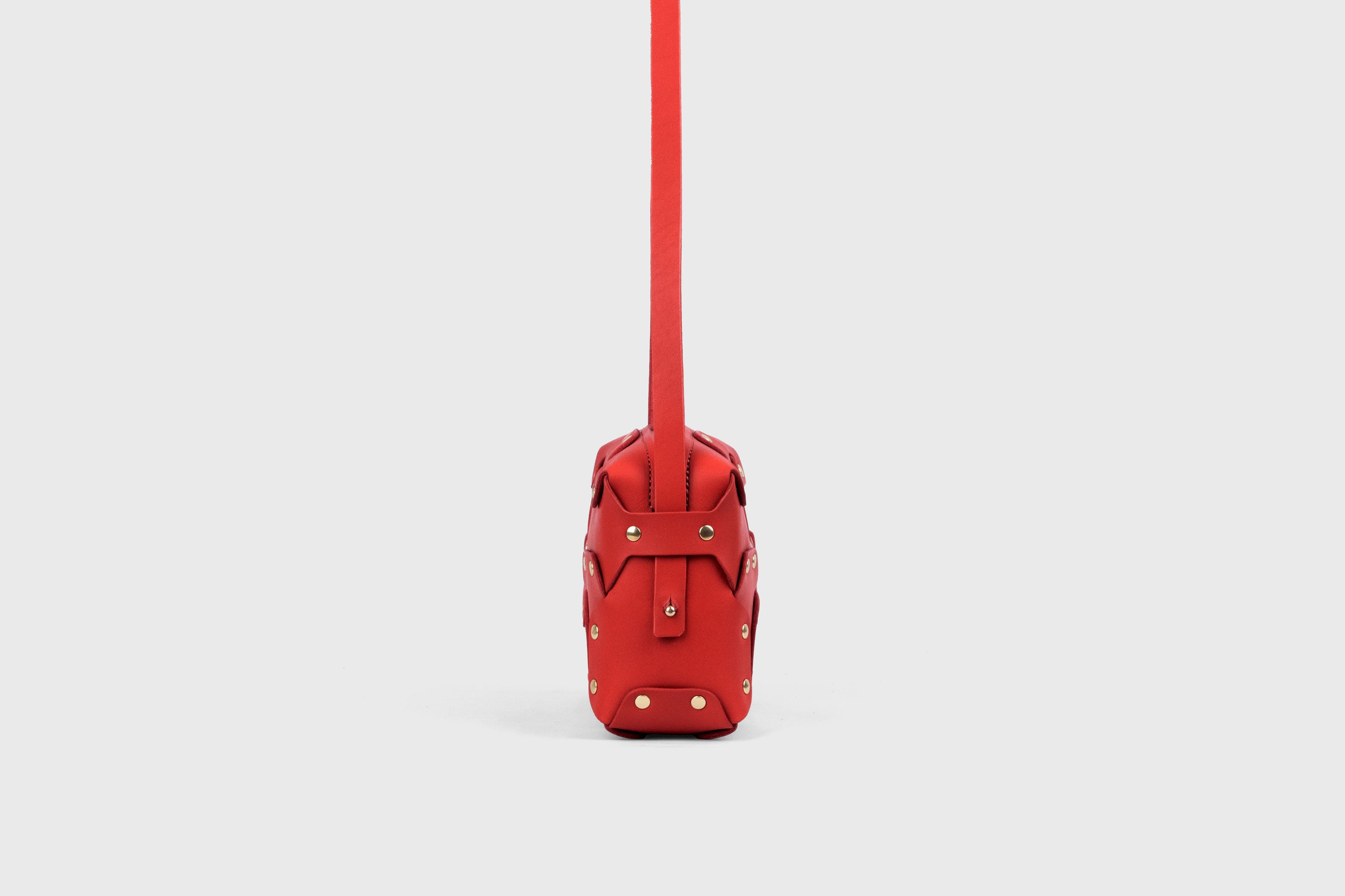 Double Rivet Bag, Red Color, Leather Full Grain Vegetable Tanned Leather Modern Minimalist Design Premium Quality Full Brass Clutch Crossbody Shoulder Bag from Atelier Madre, Manuel Dreesmann Barcelona Spain
