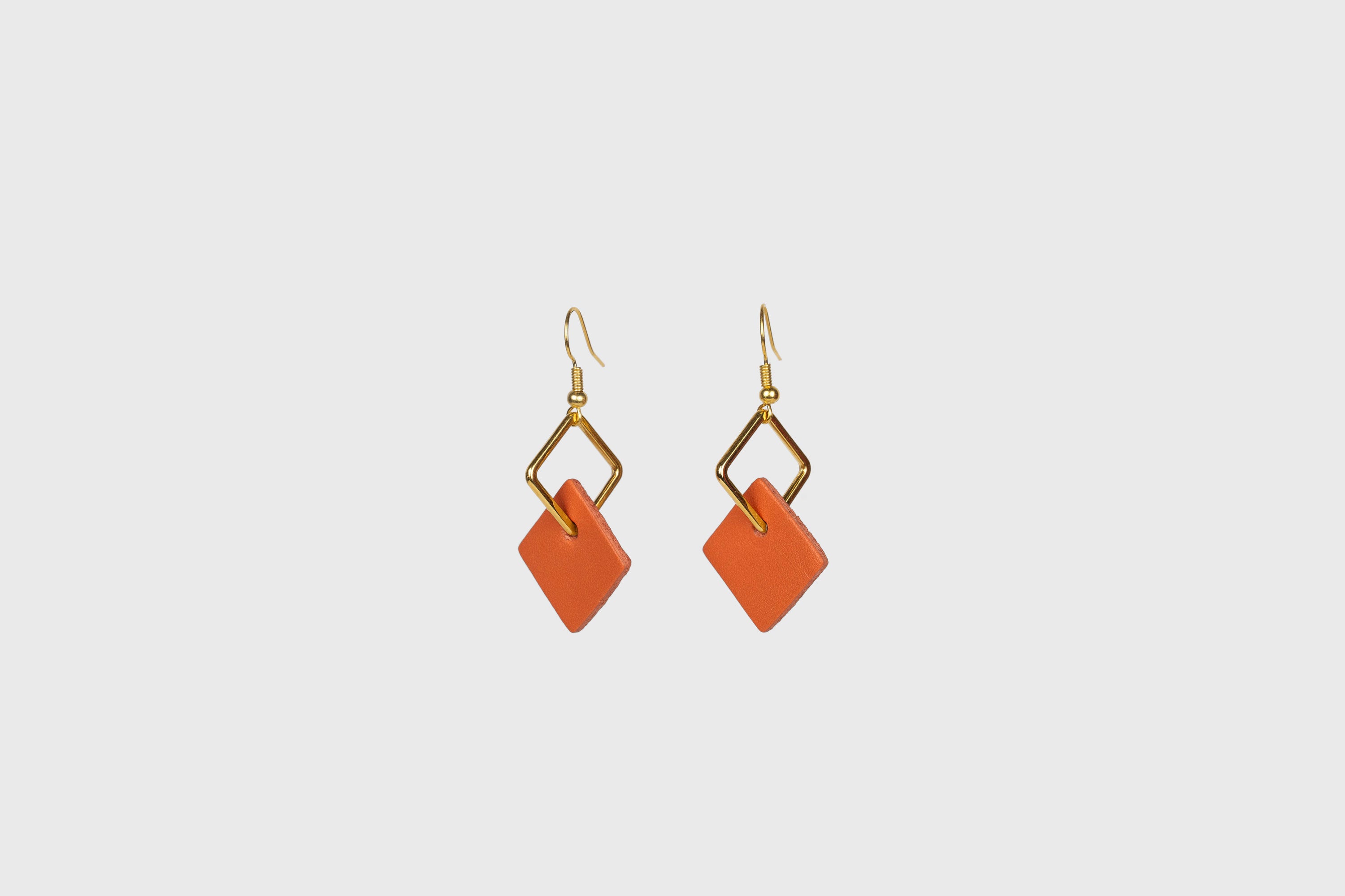Earrings Chloe In Orange Color In Vegetable Tanned Leather Minimalistic Design Atelier Manuel Dreesmann Barcelona Spain