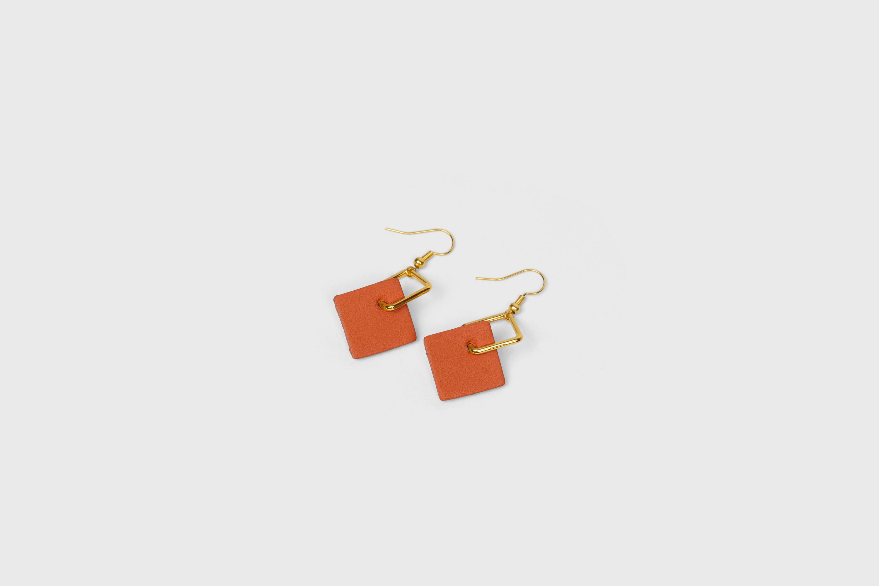 Earrings Chloe In Orange Color In Vegetable Tanned Leather Minimalistic Design Atelier Manuel Dreesmann Barcelona Spain