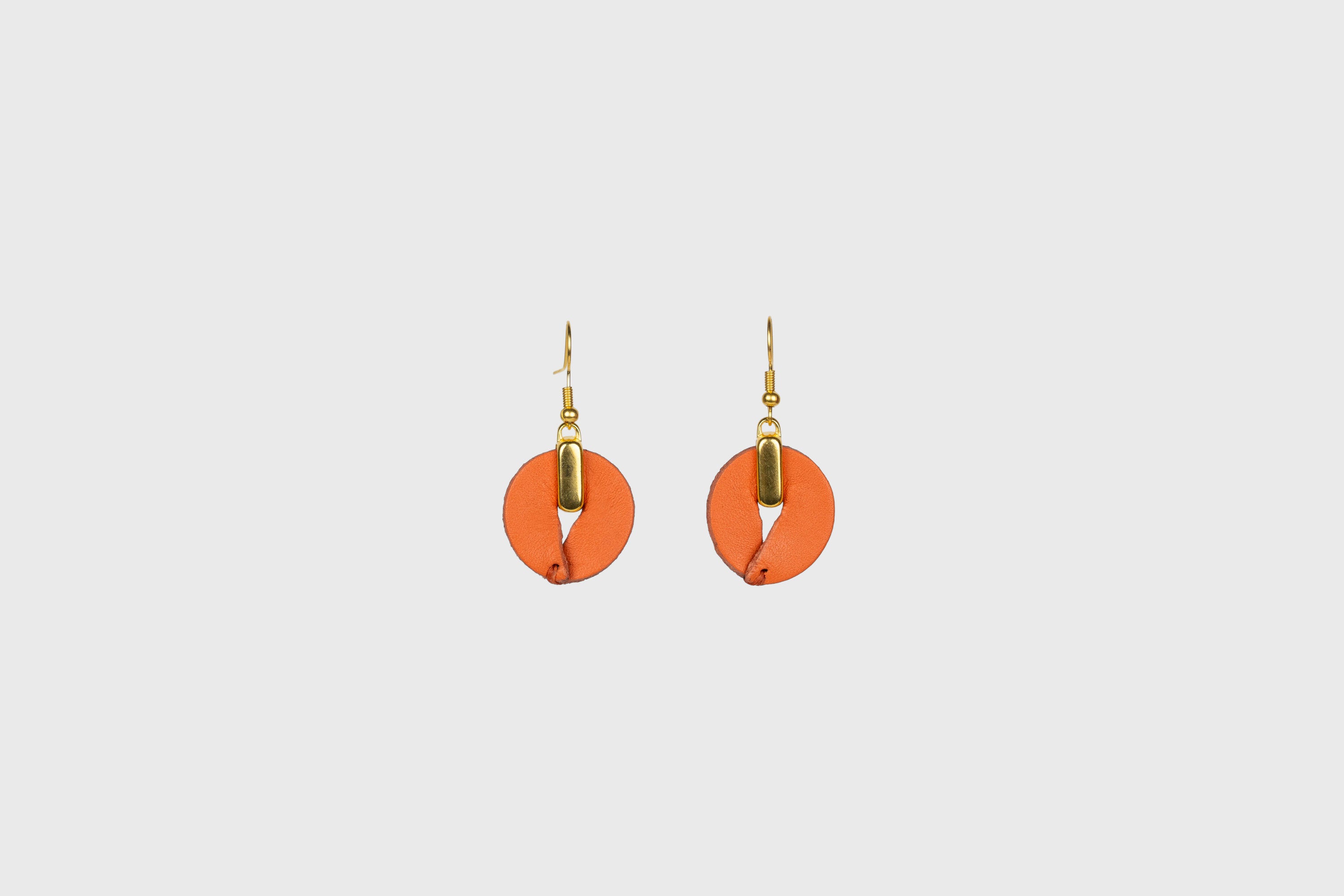 Olivia Earrings in Orange Color Vegetable Tanned Leather Minimalistic Design Atelier Madre Manuel Dreesmann Barcelona Spain