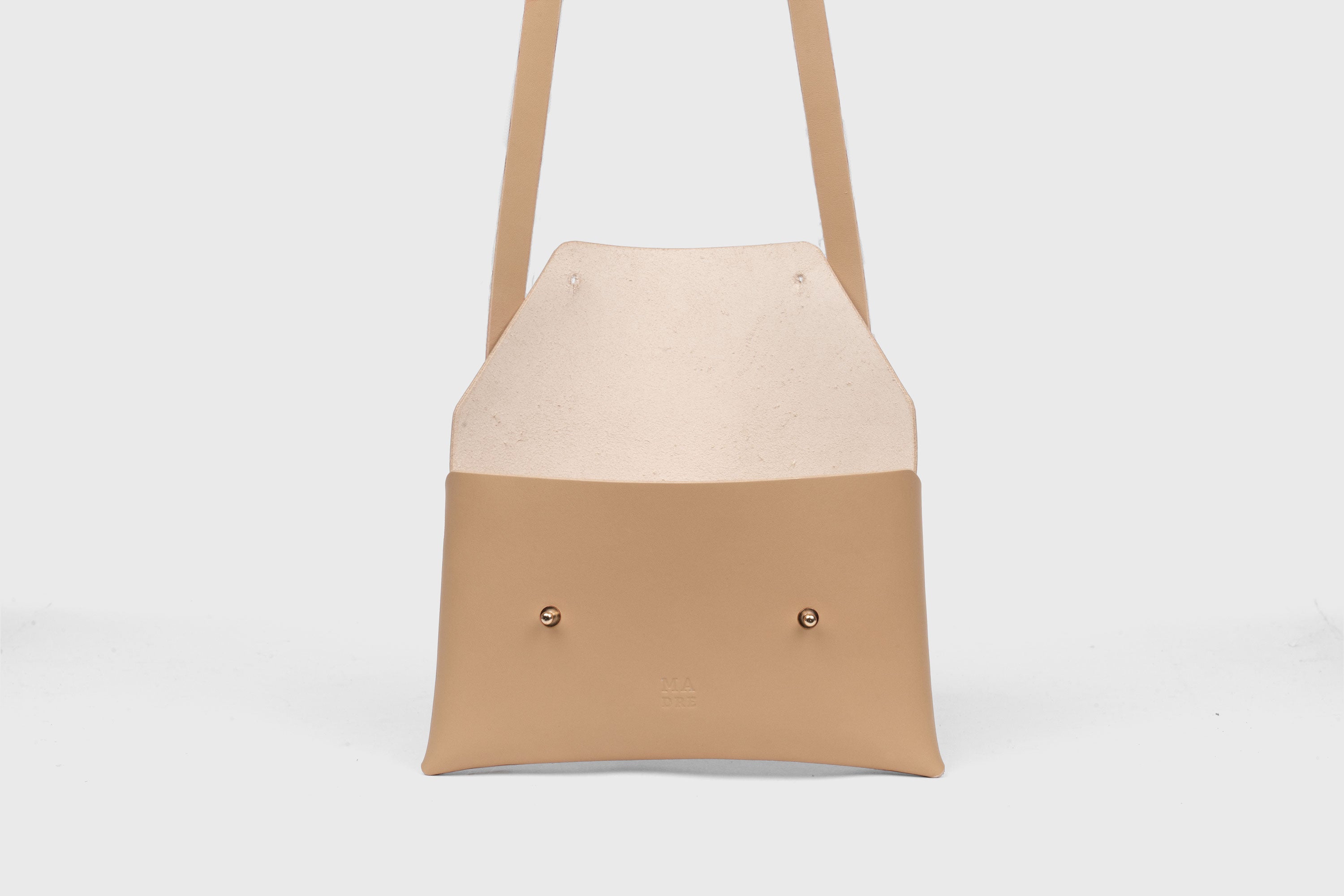 Envelope Bag With a Strap In Natural Color Vegetable Tanned Leather Minimalistic Design Atelier Madre Manuel Dreesmann Barcelona Spain